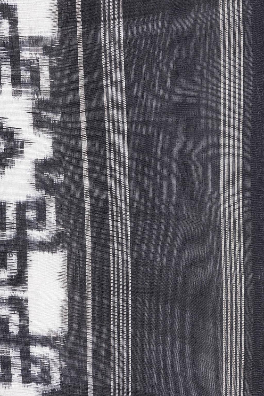 Border image of Black and White Color Double Ikat Saree with Ikat Print on the body and Thread Border. 