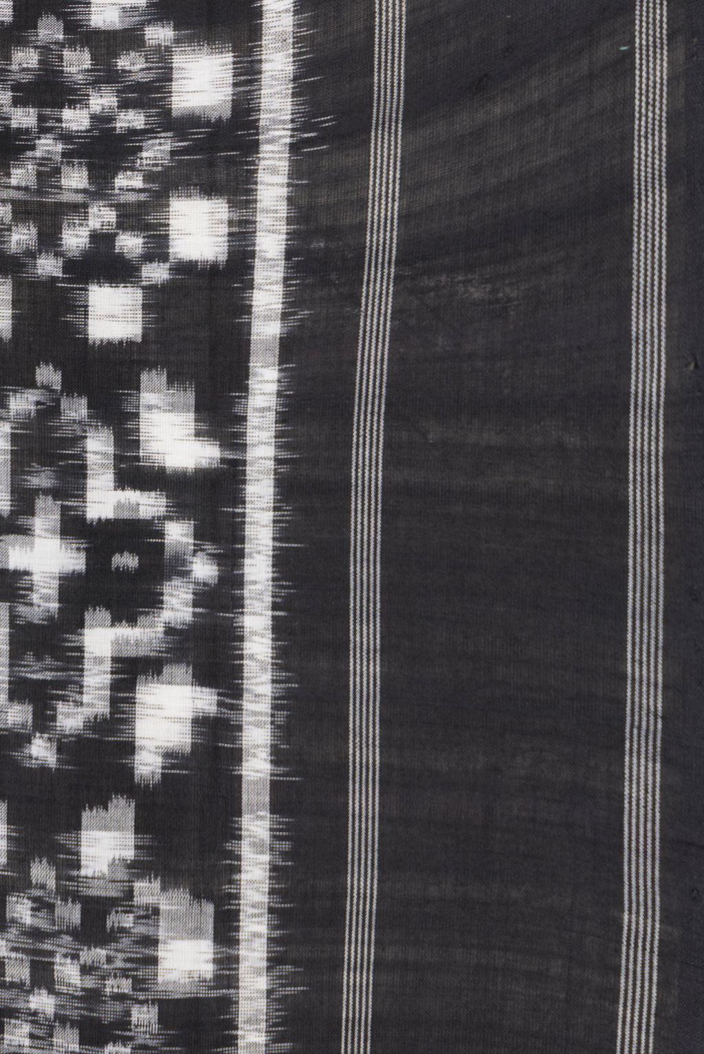 Border image of Black Dual Tone Double Ikat Saree with Ikat Print on the body and Thread Border. 