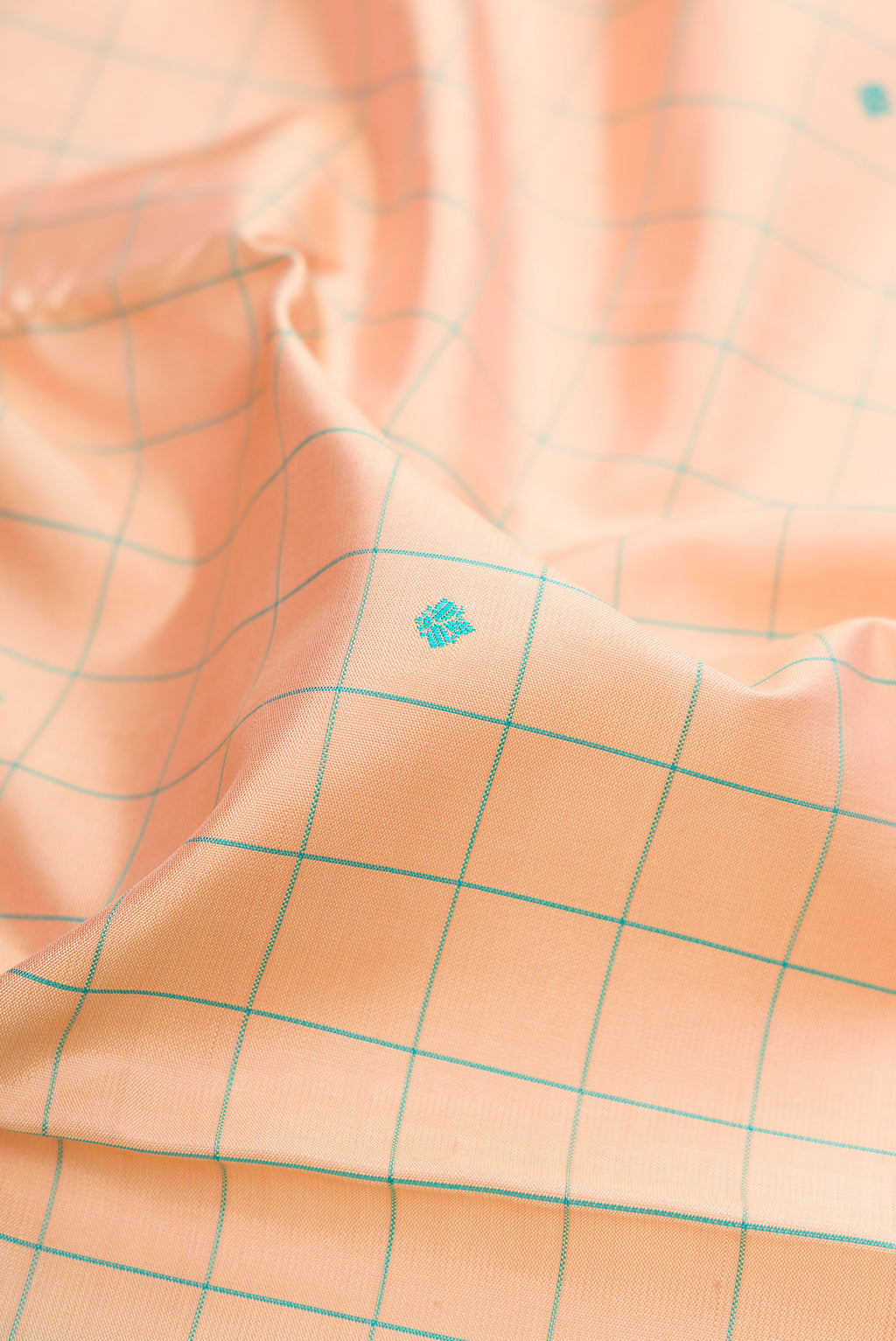 Close up of Sandal Kanjivaram Silk Saree with Checked design on the body and Thread Border.  displaying folds