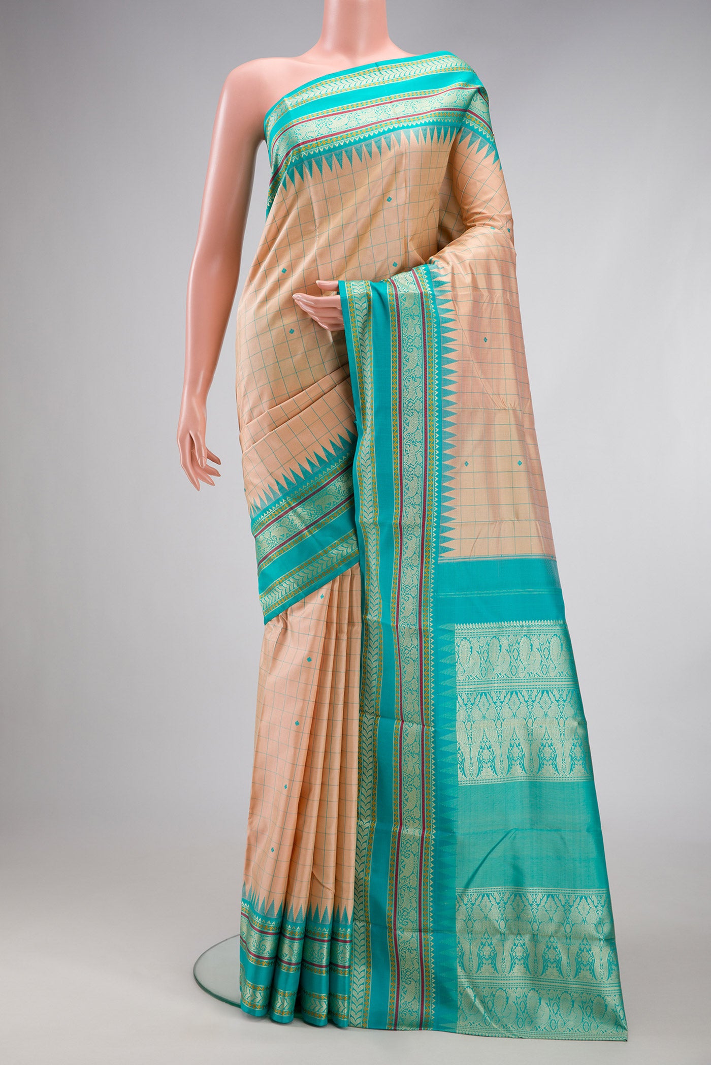 Sandal Kanjivaram Silk Saree with Checked design on the body and Thread Border.  displayed on a mannequin