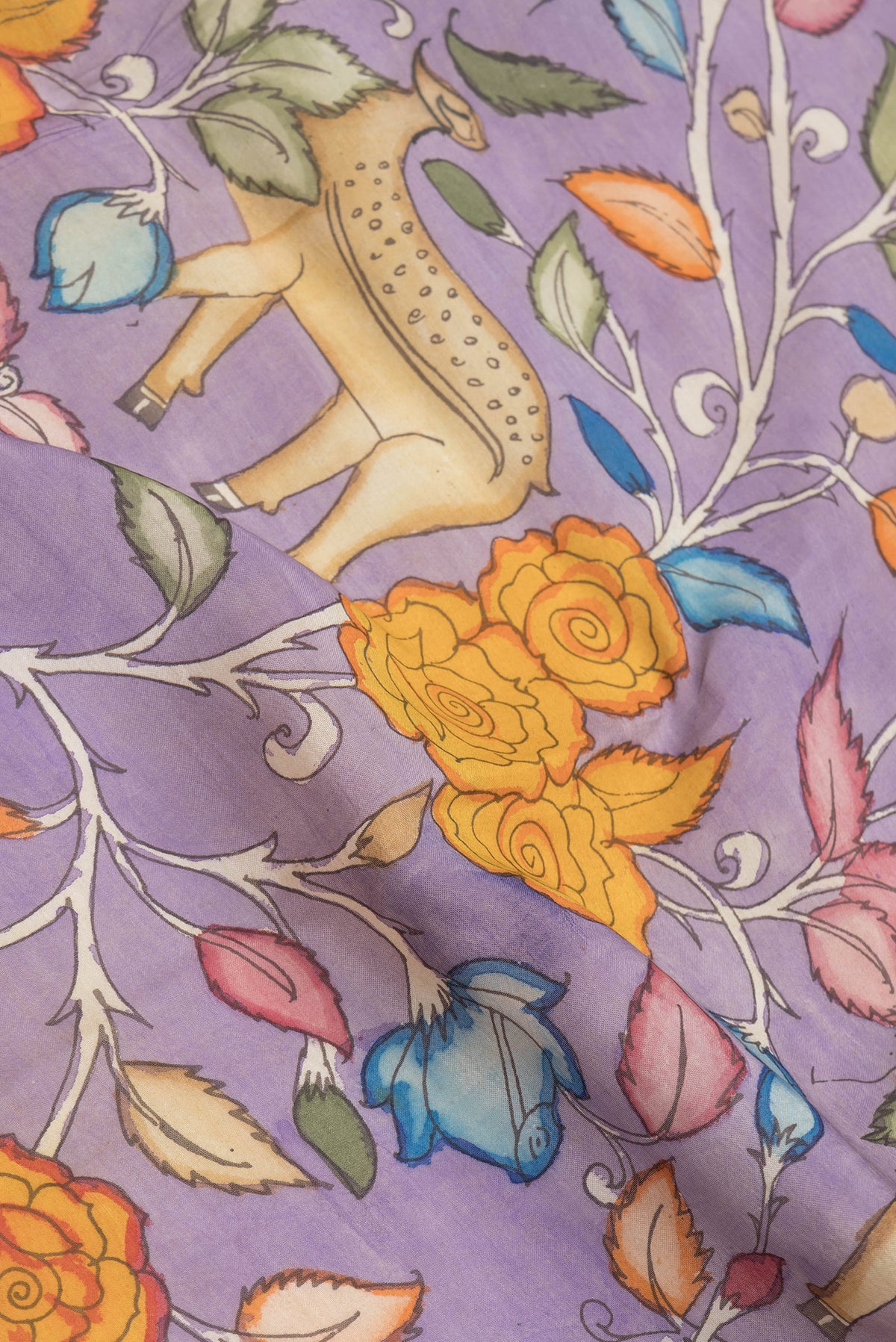 Close up of Lavender Dual Tone Tussar Silk Saree with kalamkari Print on the body and Fancy Border.  displaying folds
