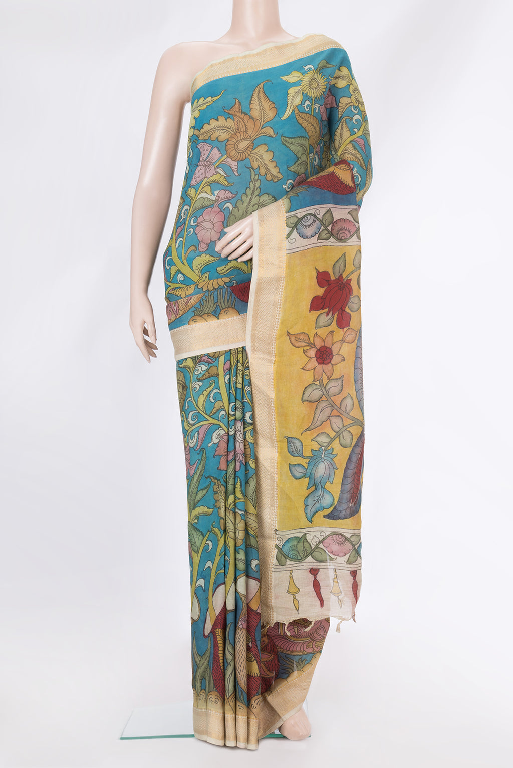 Sky Blue Tussar Silk Saree with kalamkari Print on the body and Zari Border.  displayed on a mannequin