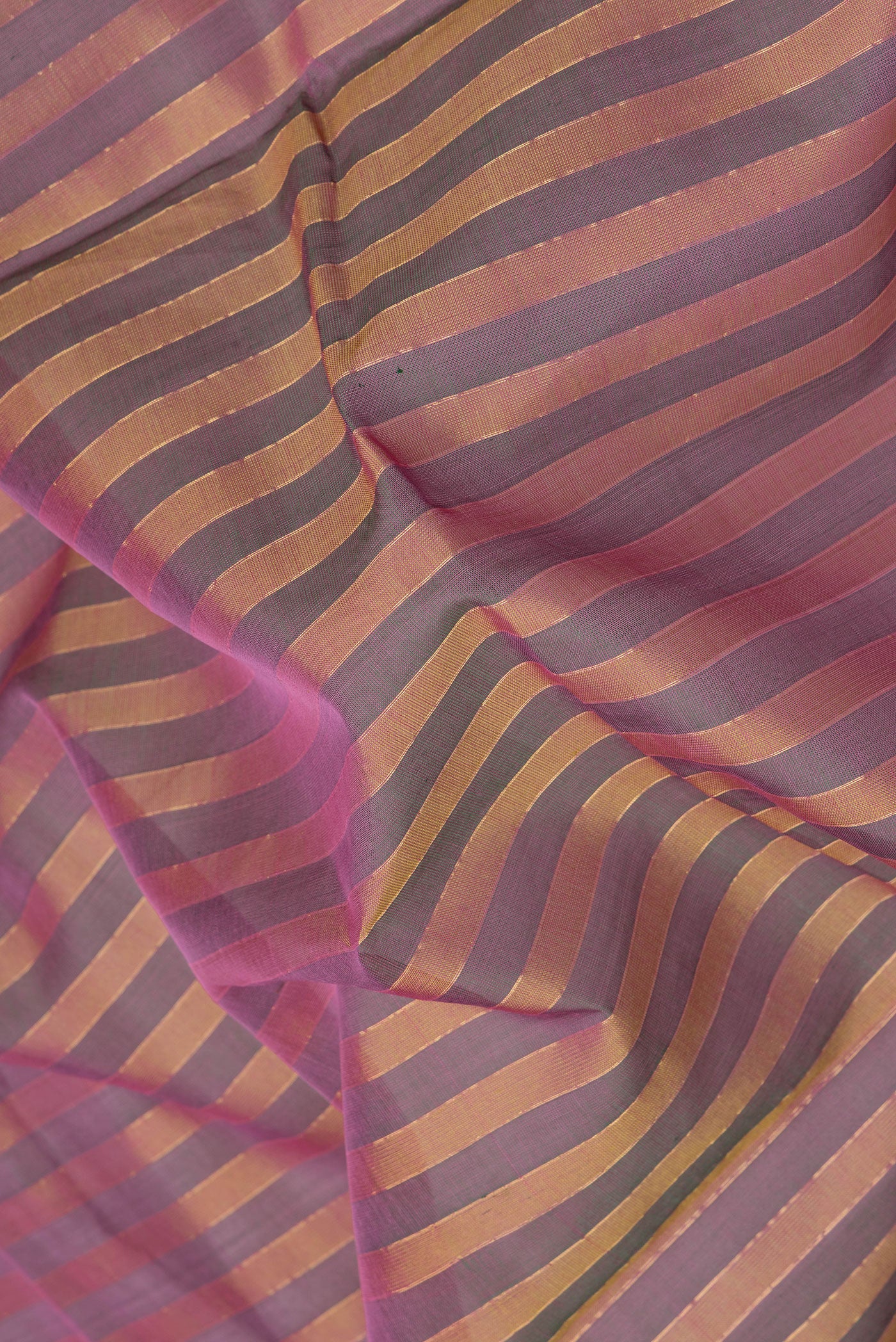 Close up of Multi Color Silk Cotton Saree with Stripes on the body and Zari Border.  displaying folds