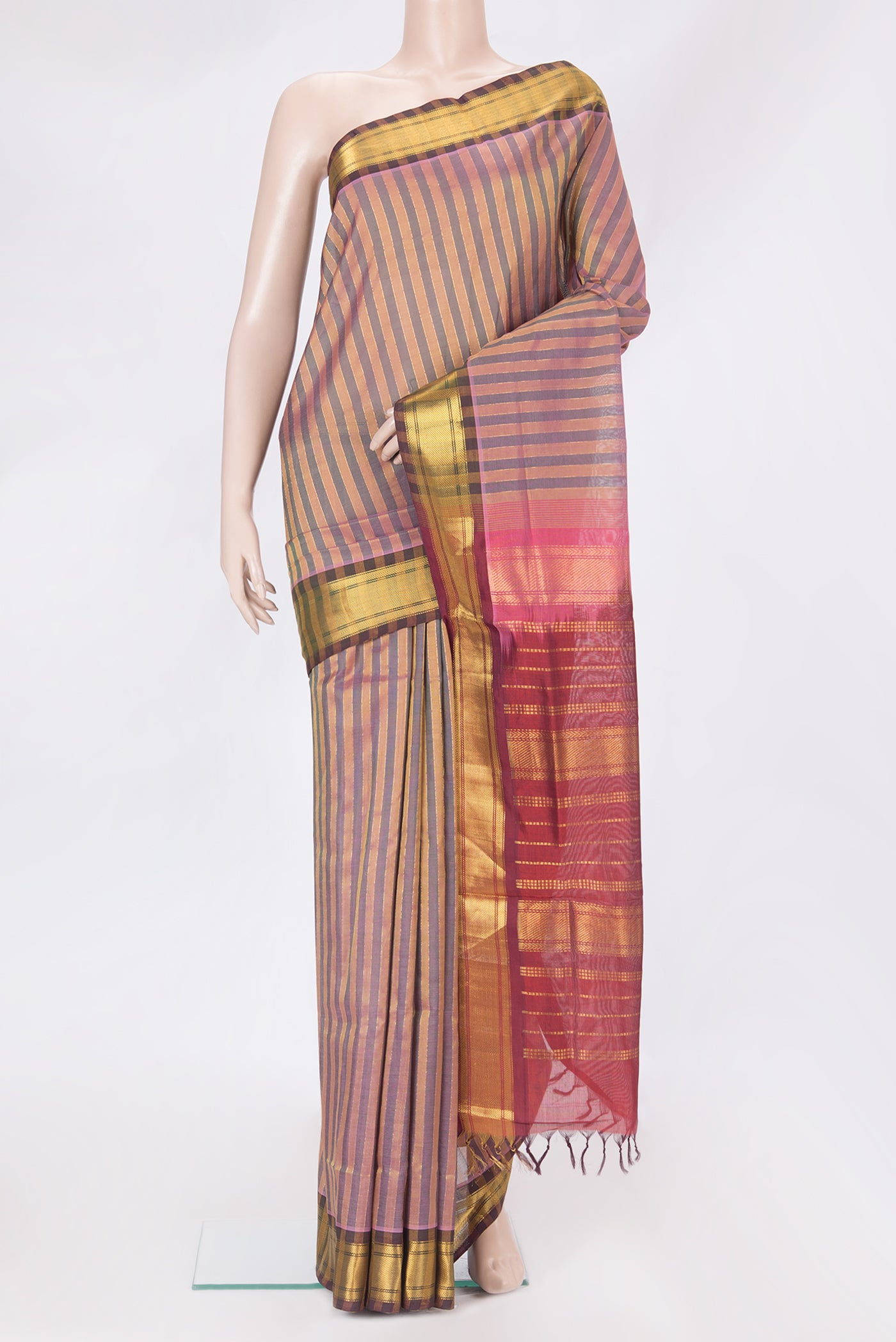 Multi Color Silk Cotton Saree with Stripes on the body and Zari Border.  displayed on a mannequin