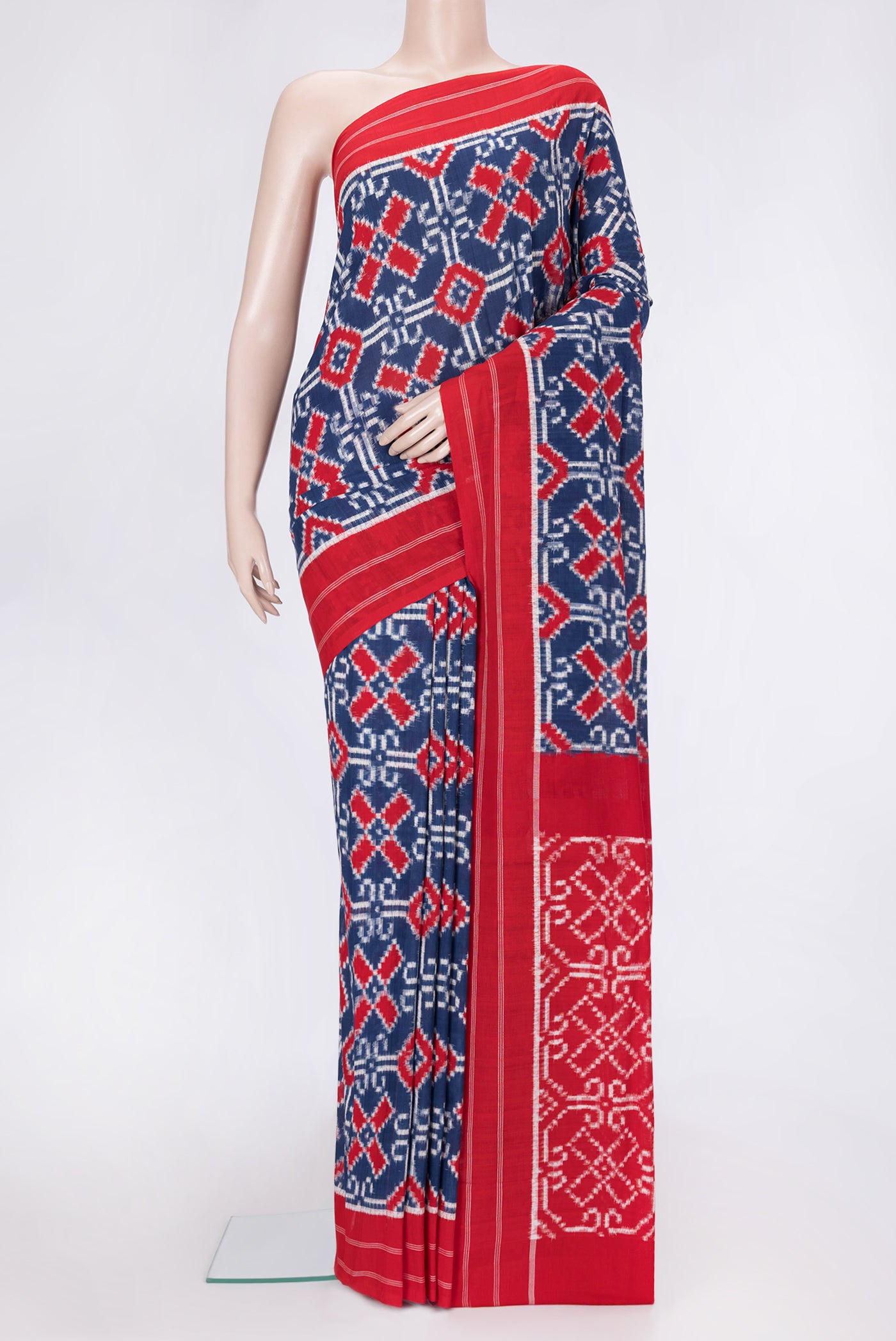 Navy Blue Dual Tone Double Ikat Saree with Ikat Print on the body and Thread Border.  displayed on a mannequin