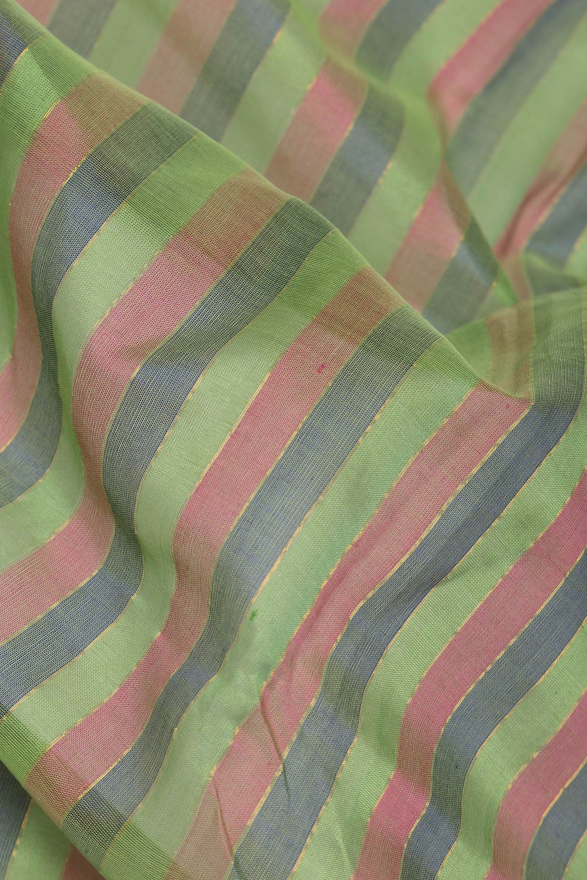 Close up of Green and Maroon Color Silk Cotton Saree with Stripes on the body and Zari Border.  displaying folds