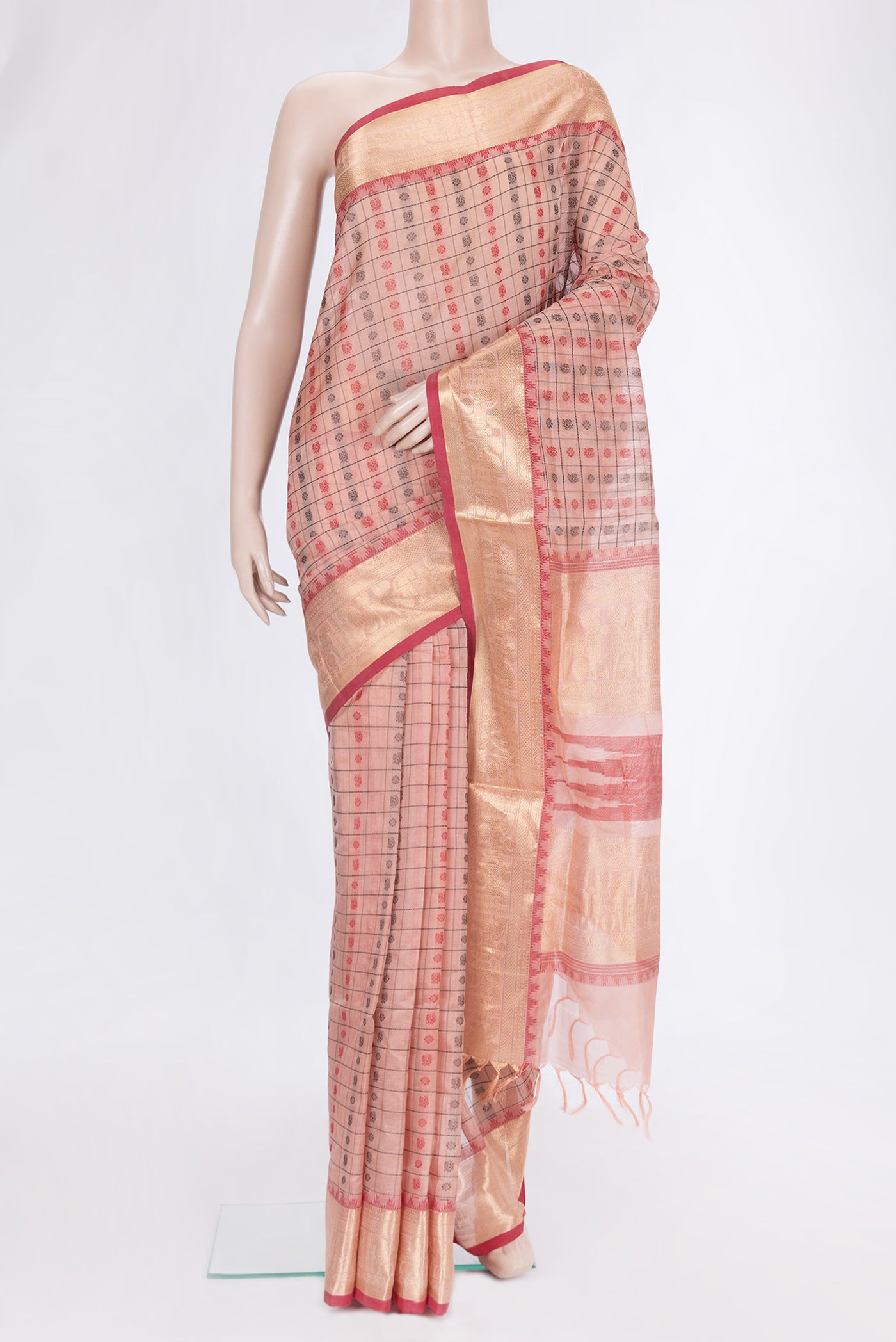 Peach Dual Tone Silk Cotton Saree with Thread Butta on the body and Zari Border.  displayed on a mannequin