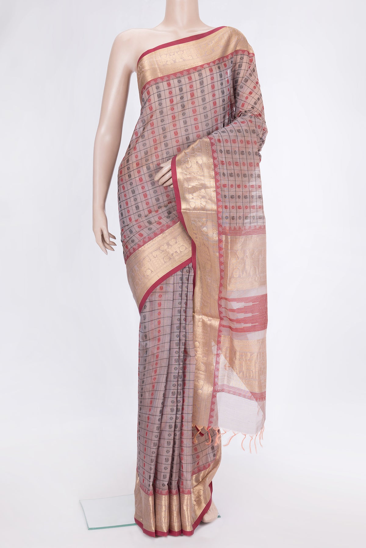 Golden Peach Dual Tone Silk Cotton Saree with Thread Butta on the body and Zari Border.  displayed on a mannequin