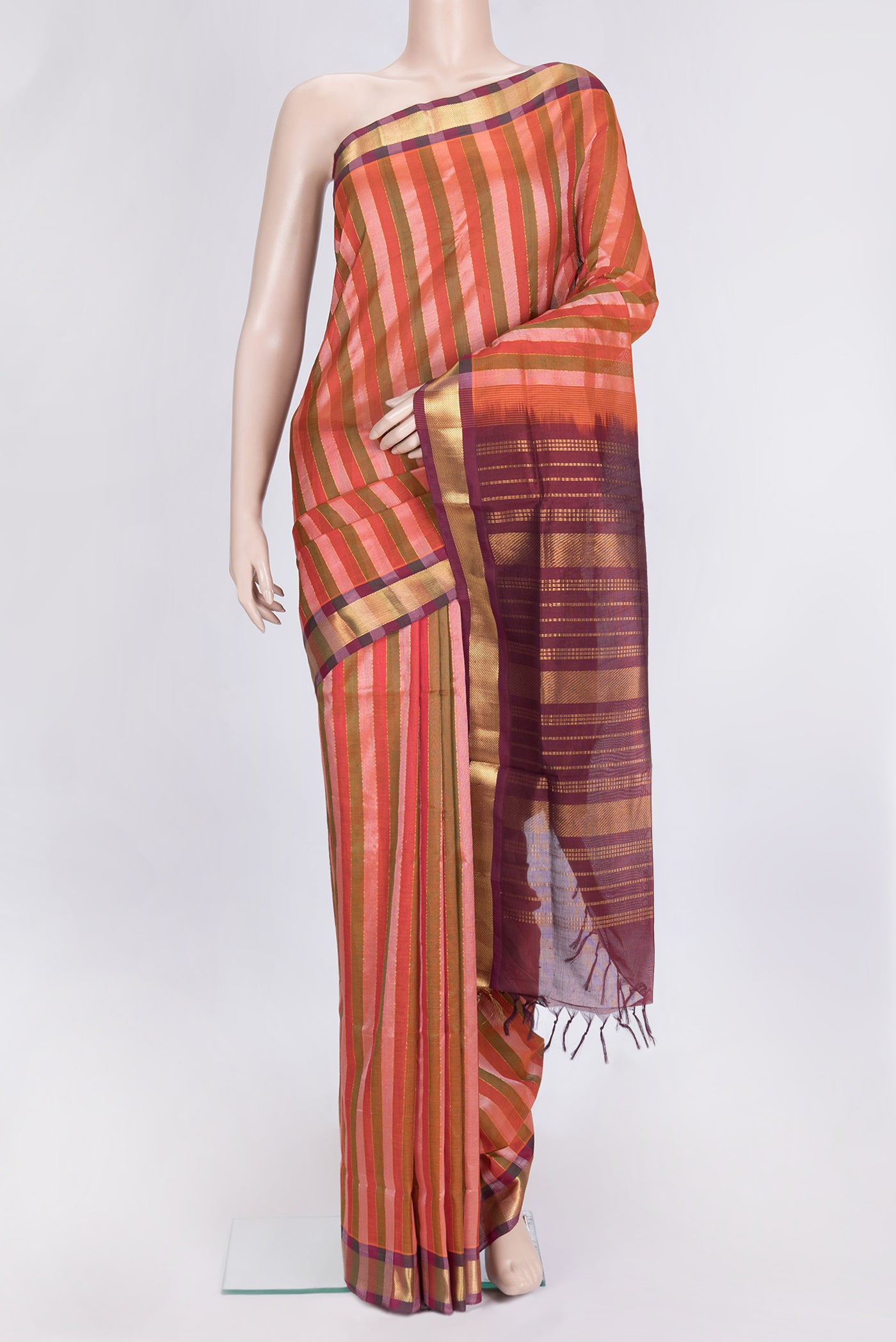 Red and Green Color Silk Cotton Saree with Stripes on the body and Zari Border.  displayed on a mannequin