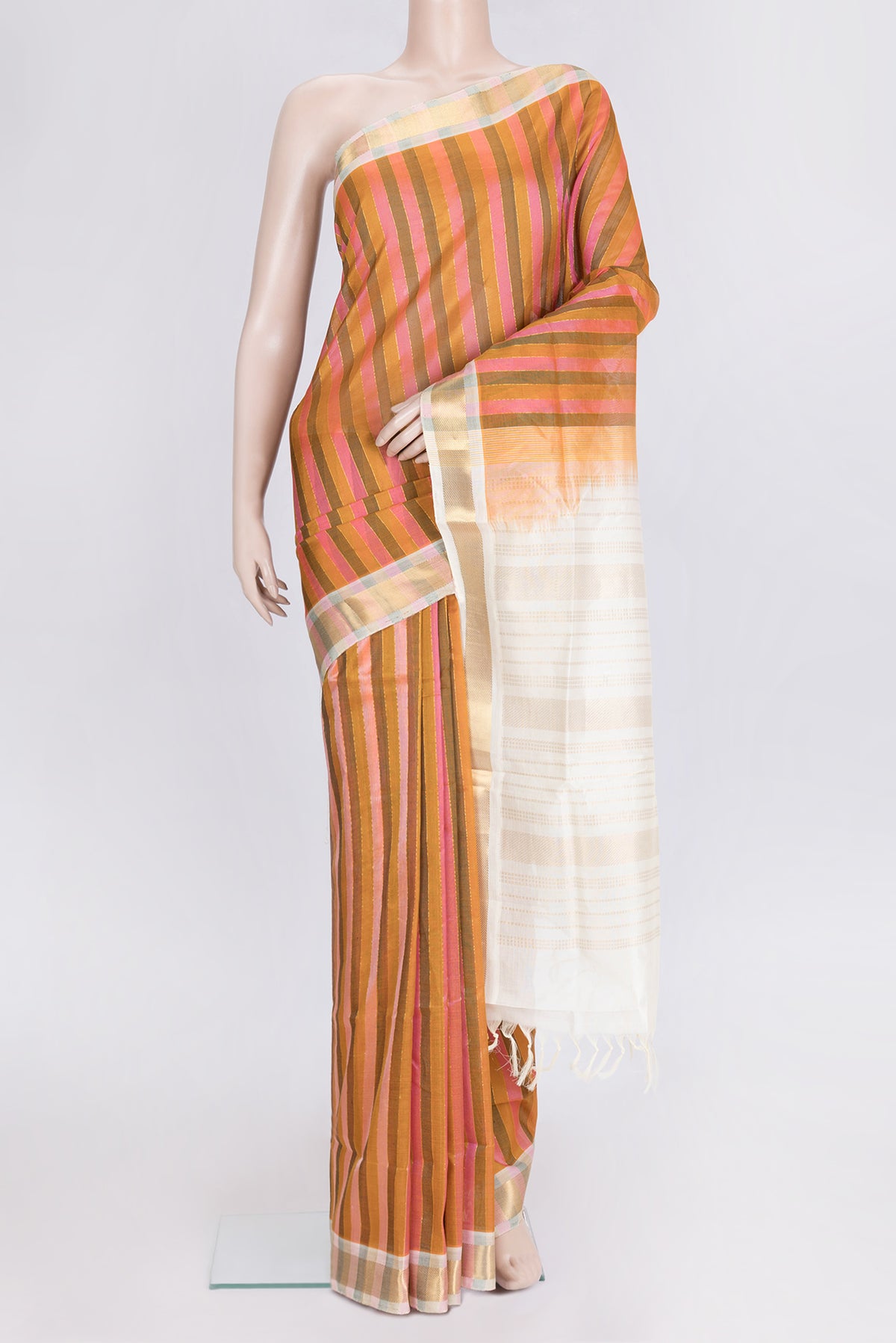 Pink and Mustard Color Silk Cotton Saree with Stripes on the body and Zari Border.  displayed on a mannequin