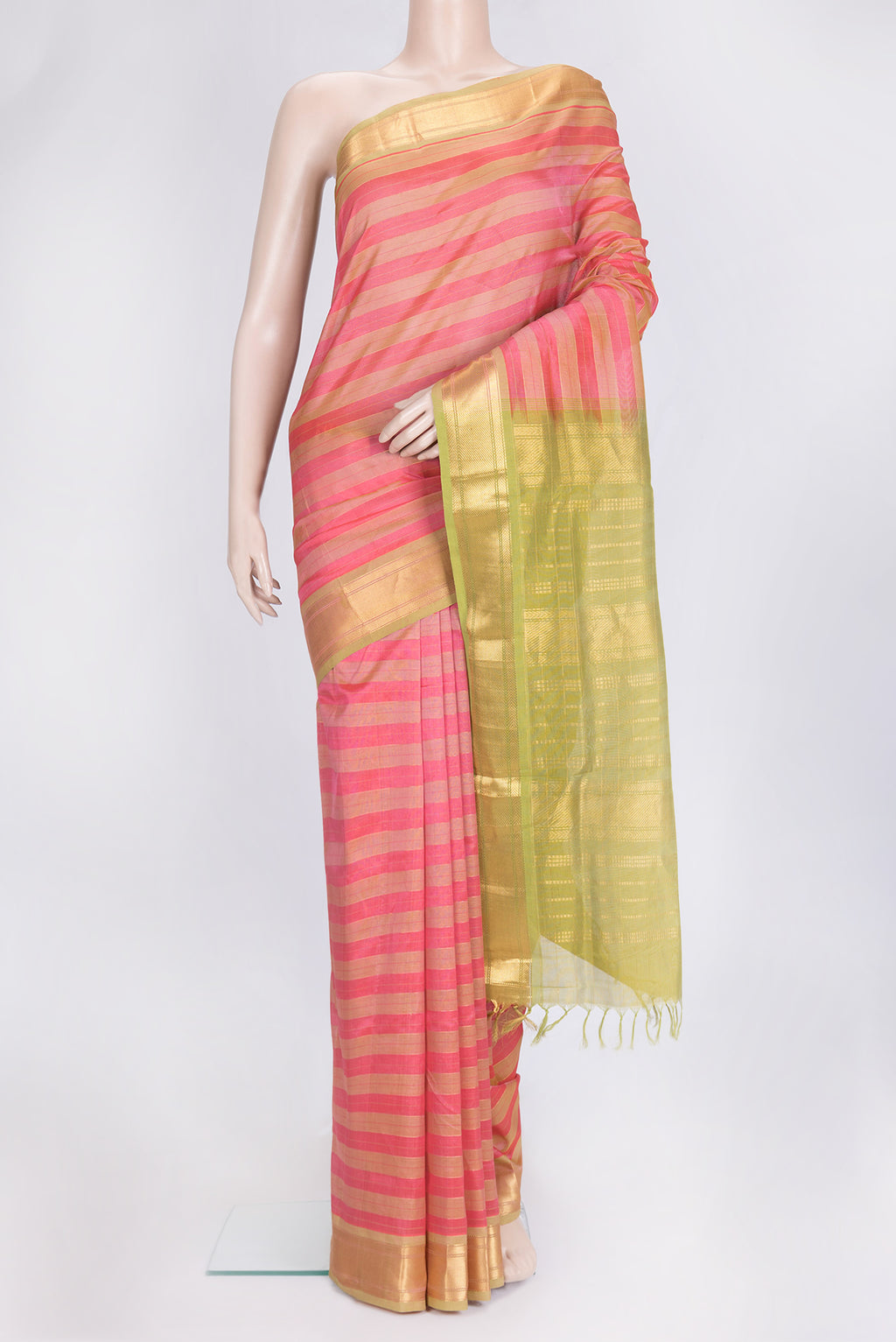 Pink and Green Color Silk Cotton Saree with Stripes on the body and Zari Border.  displayed on a mannequin