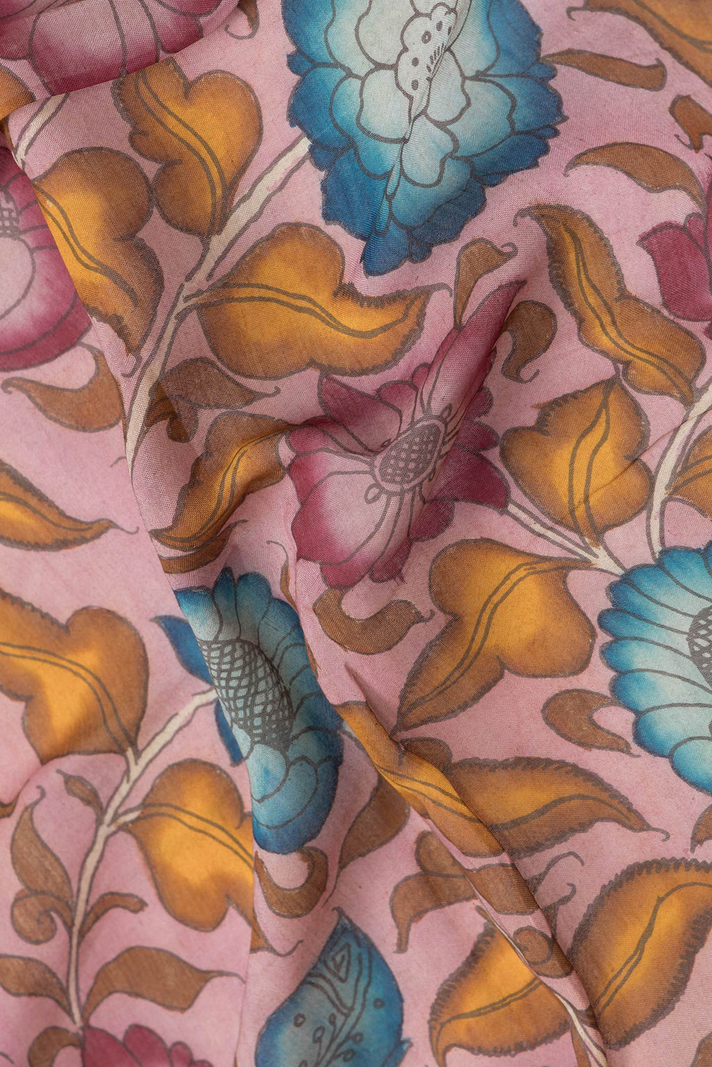 Close up of Pink Dual Tone Tussar Silk Saree with kalamkari Print on the body and Zari Border.  displaying folds