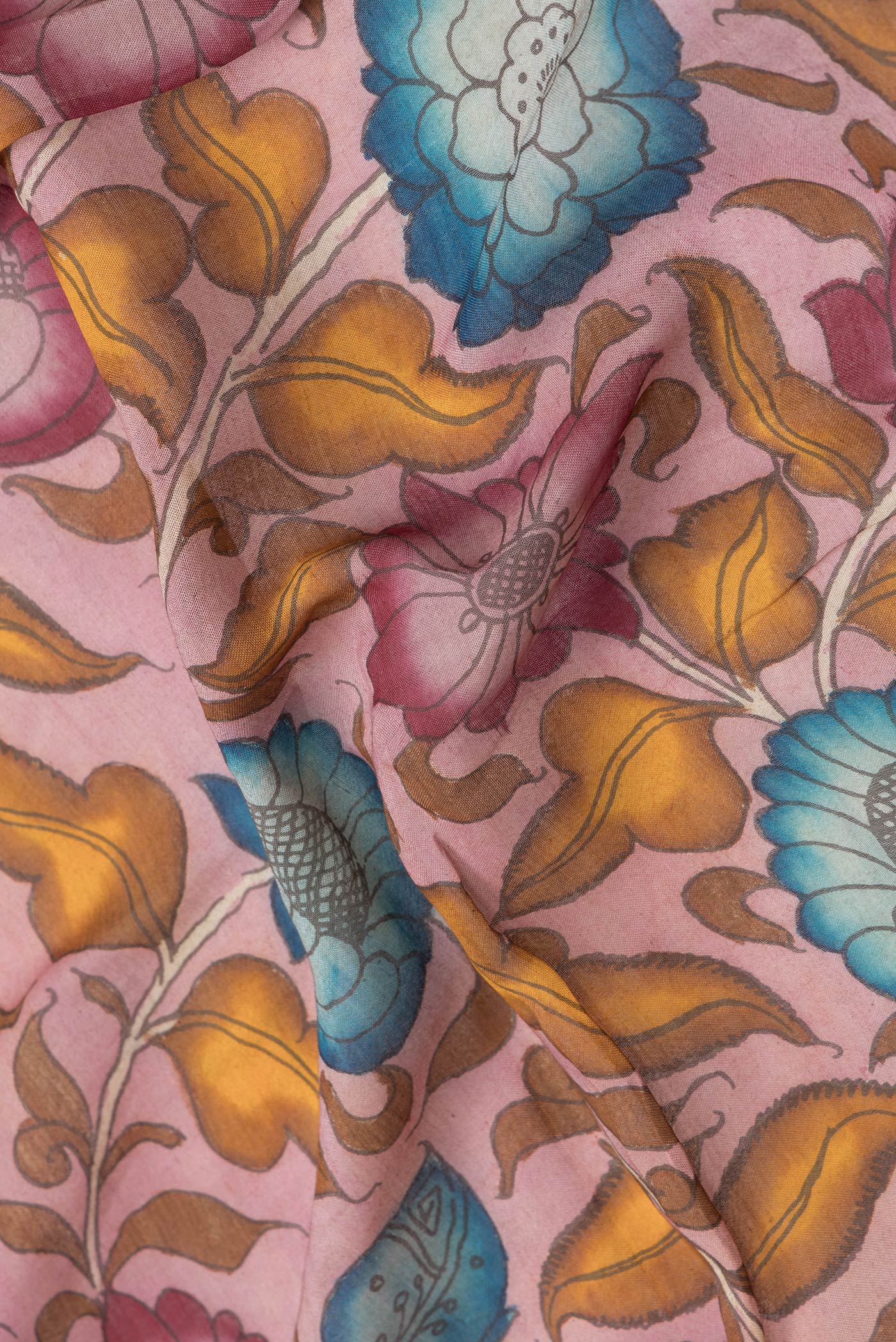 Close up of Pink Dual Tone Tussar Silk Saree with kalamkari Print on the body and Zari Border.  displaying folds