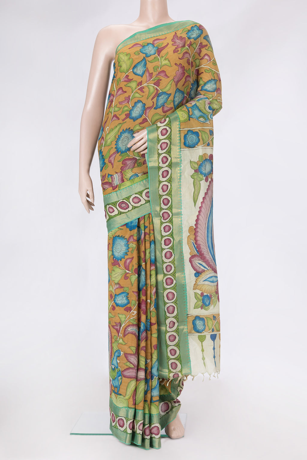 Mustard Dual Tone Tussar Silk Saree with kalamkari Print on the body and Zari Border.  displayed on a mannequin