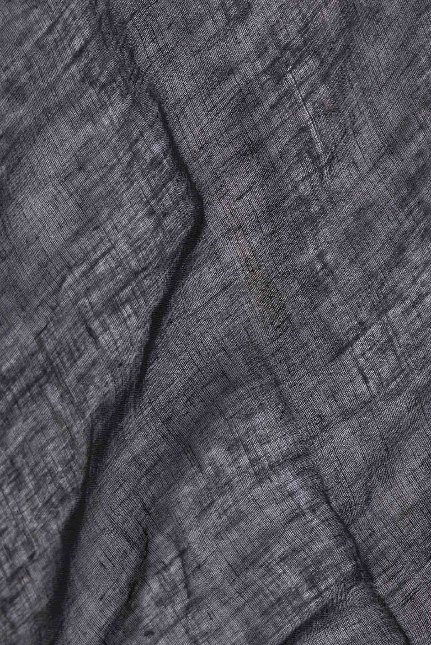 Close up of Black Dual Tone Linen Saree with Embroidery on the body and Embroidery Border.  displaying folds