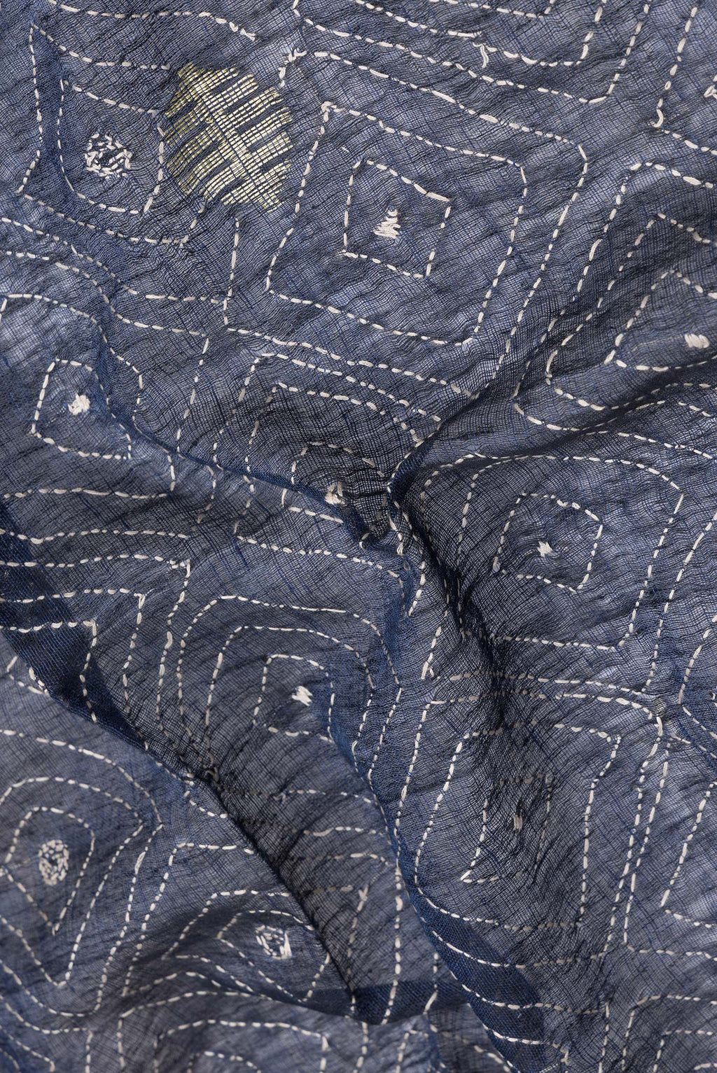 Close up of Navy Blue Dual Tone Tussar Silk Saree with Embroidery on the body and Plain Border.  displaying folds