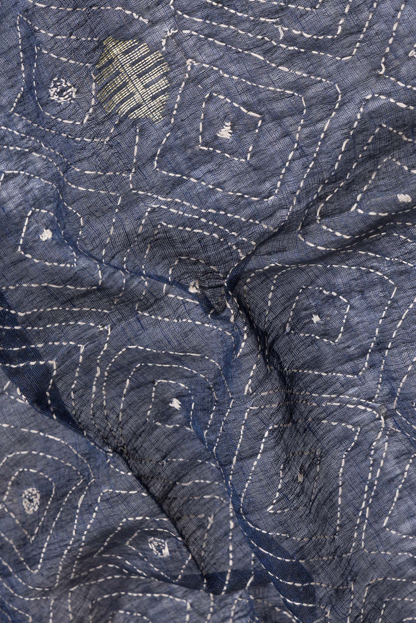 Close up of Navy Blue Dual Tone Tussar Silk Saree with Embroidery on the body and Plain Border.  displaying folds