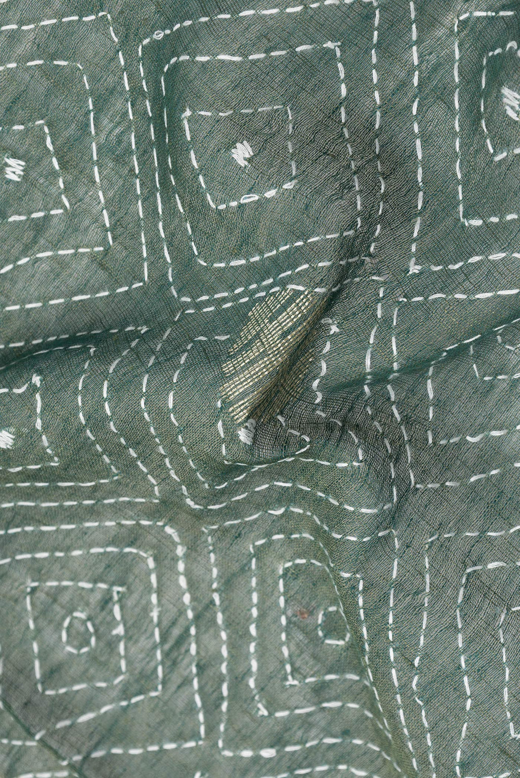 Close up of Bottle Green Dual Tone Tussar Silk Saree with Embroidery on the body and Plain Border.  displaying folds