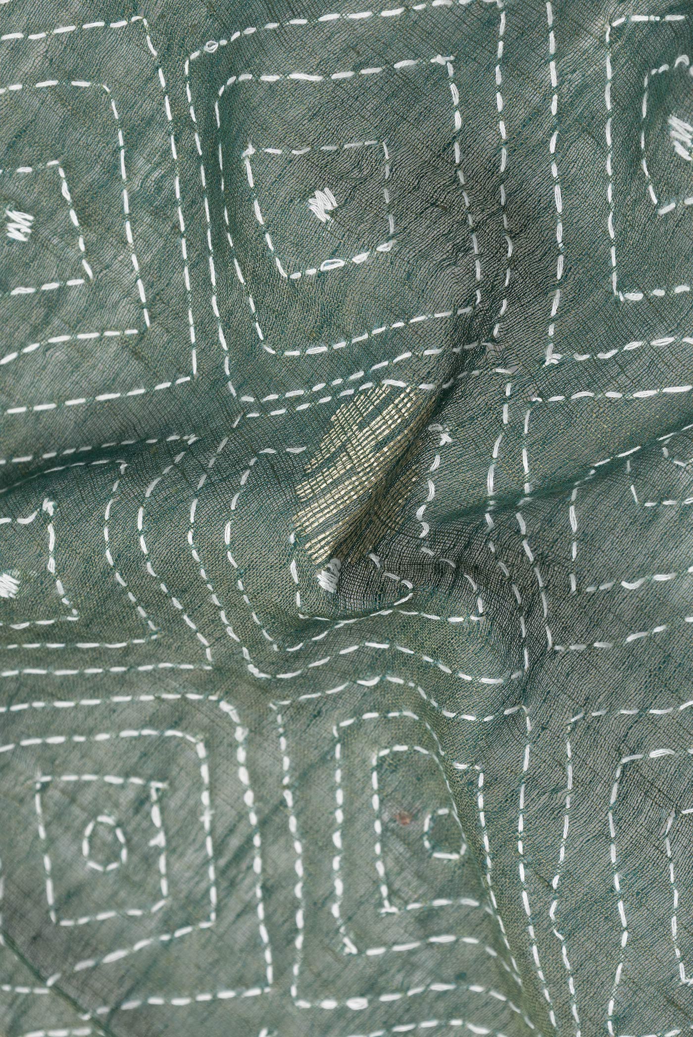 Close up of Bottle Green Dual Tone Tussar Silk Saree with Embroidery on the body and Plain Border.  displaying folds