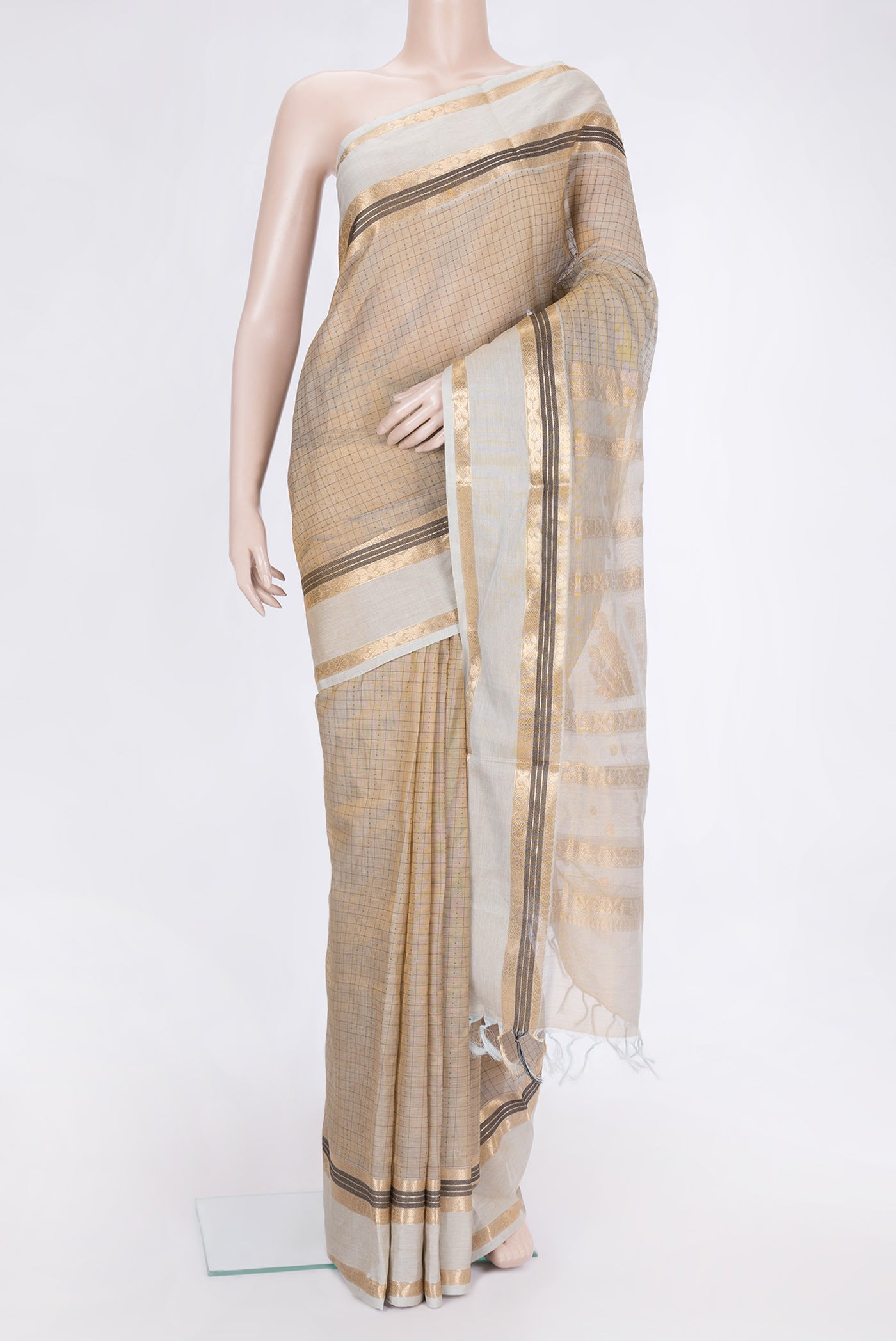 Gold Dual Tone Silk Cotton Saree with Thread Butta on the body and Zari Border.  displayed on a mannequin