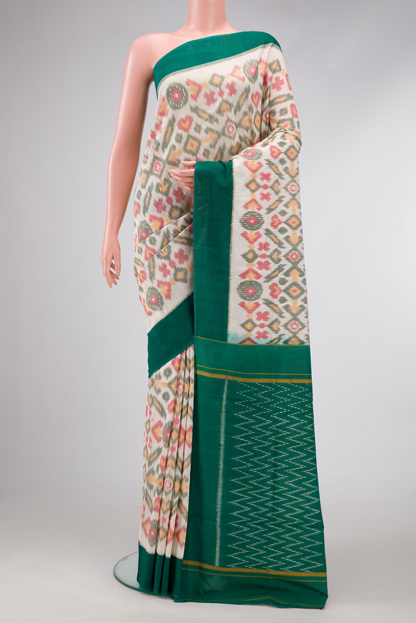 Off White Dual Tone Double Ikat Saree with Ikat Print on the body and Plain Border.  displayed on a mannequin