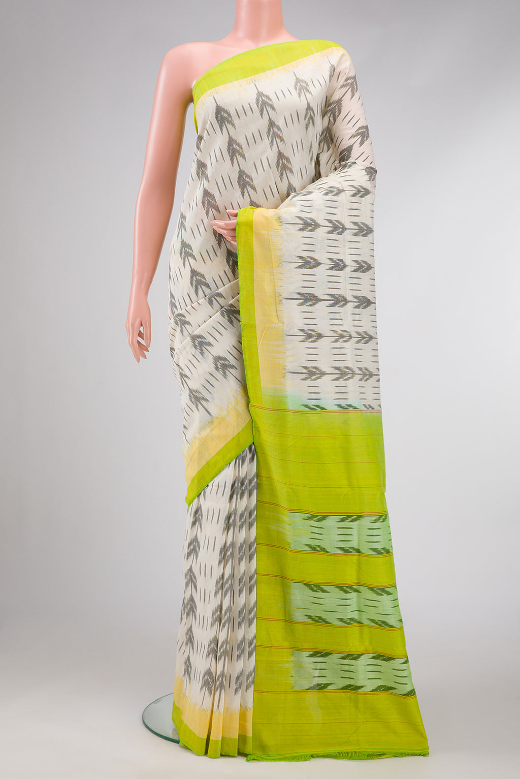 Off White Dual Tone Double Ikat Saree with Ikat Print on the body and Plain Border.  displayed on a mannequin