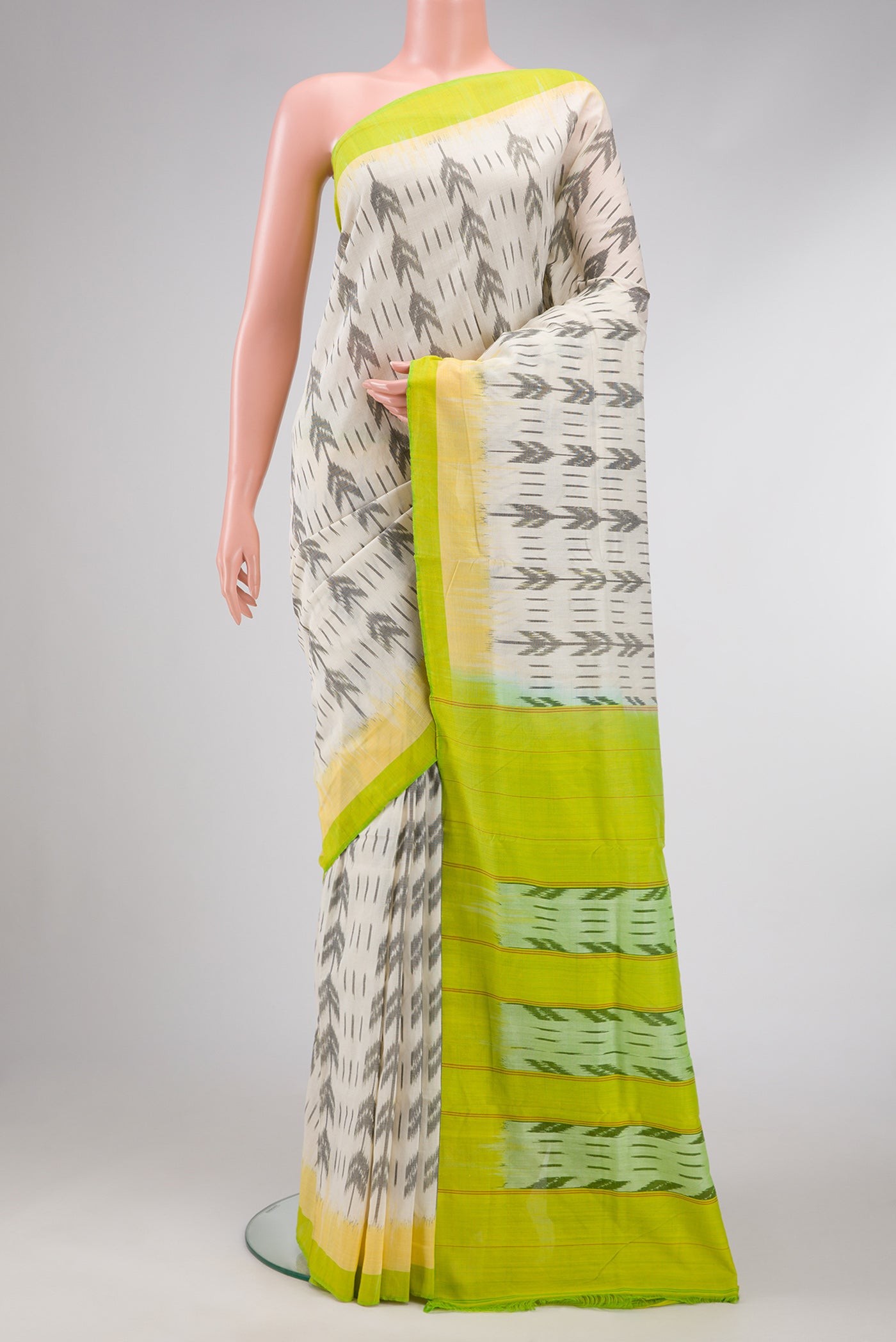 Off White Dual Tone Double Ikat Saree with Ikat Print on the body and Plain Border.  displayed on a mannequin