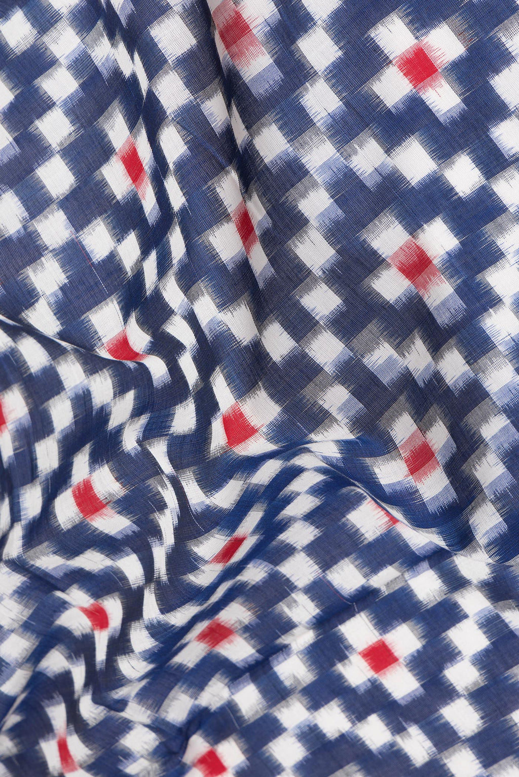 Close up of Dark Blue Pochampally Cotton Saree with Ikat design on the body and Plain Border.  displaying folds