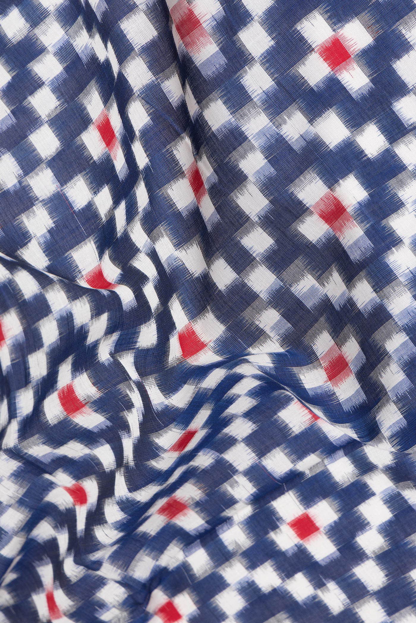 Close up of Dark Blue Pochampally Cotton Saree with Ikat design on the body and Plain Border.  displaying folds