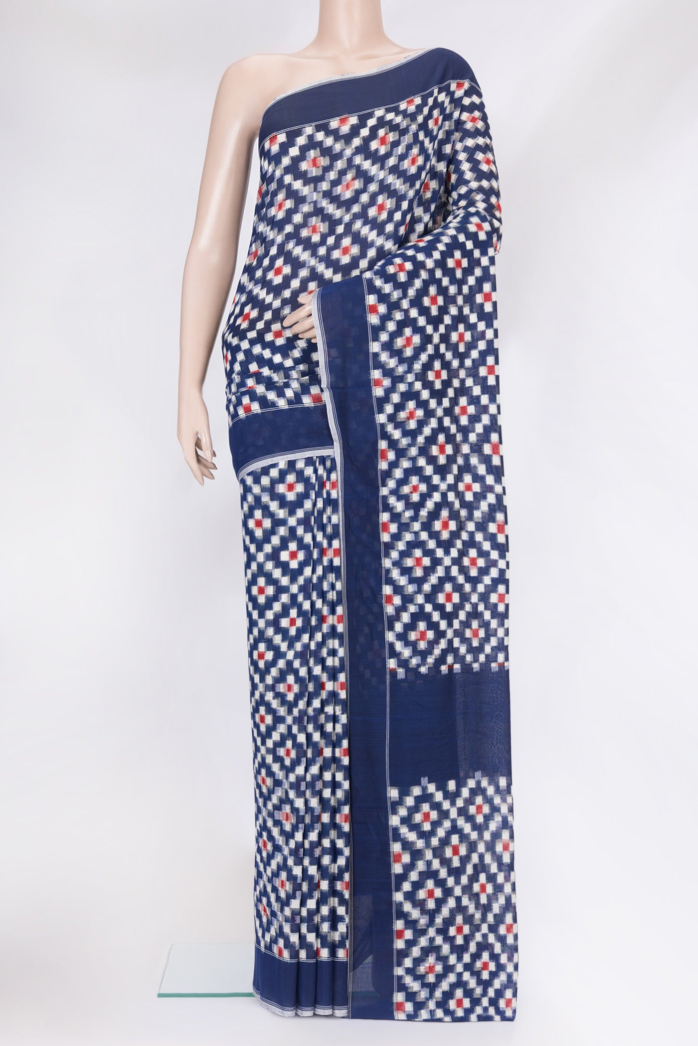 Dark Blue Pochampally Cotton Saree with Ikat design on the body and Plain Border.  displayed on a mannequin
