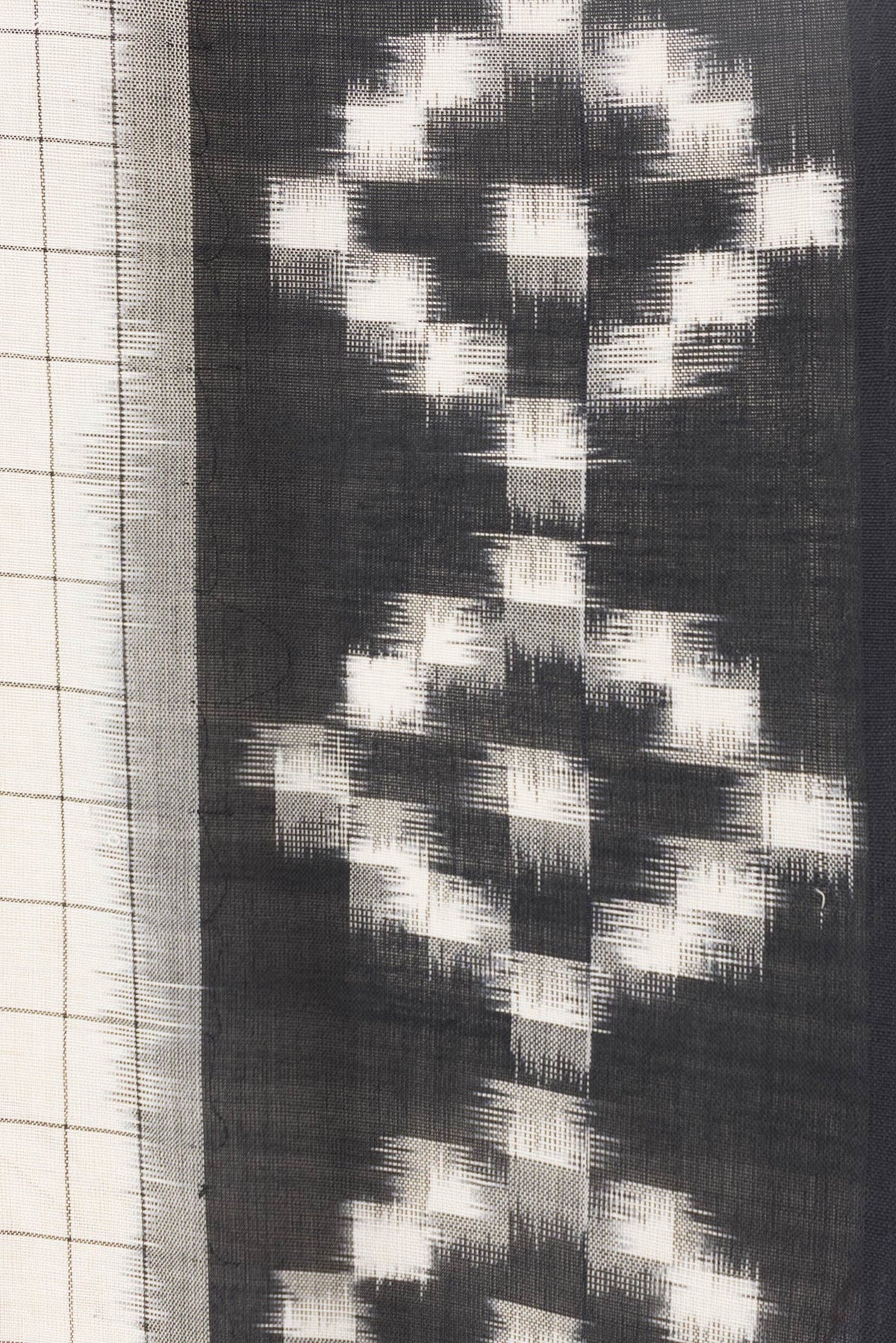 Border image of Off White Dual Tone Double Ikat Saree with Checked design on the body and Ikat Border. 