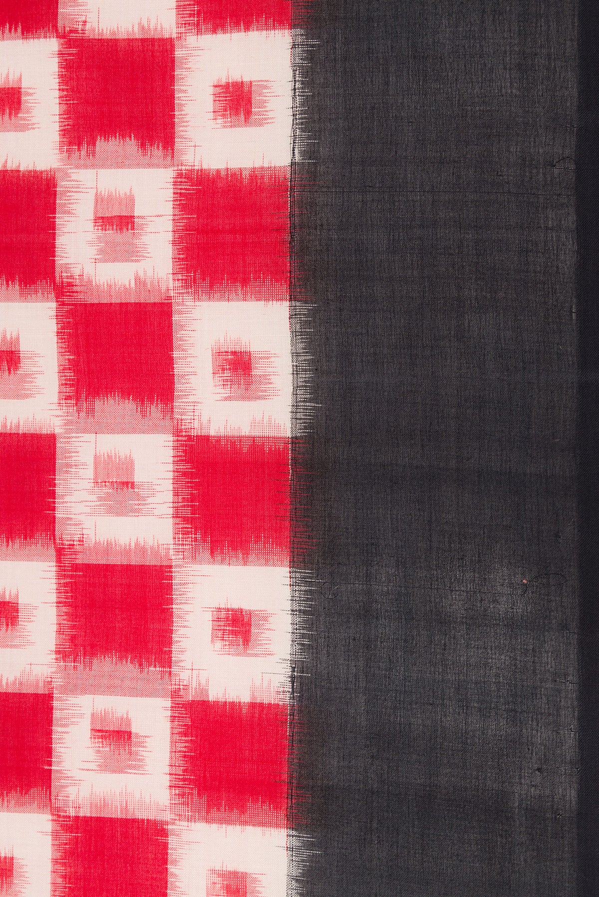 Border image of Red Dual Tone Double Ikat Saree with Ikat Print on the body and Plain Border. 