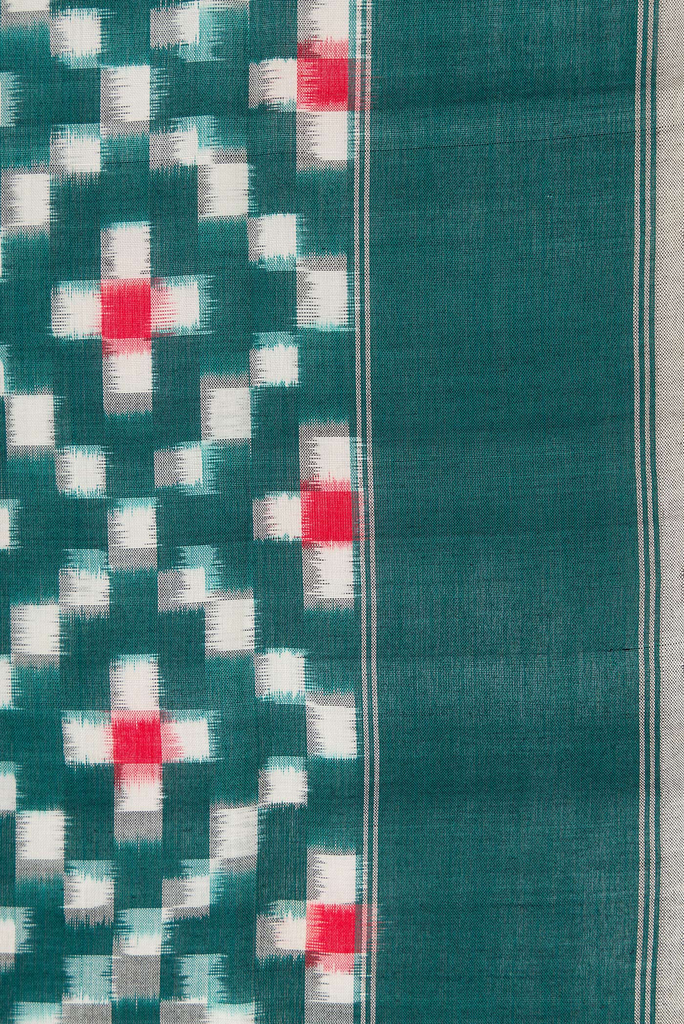 Border image of Bottle Green Dual Tone Double Ikat Saree with Ikat Print on the body and Plain Border. 