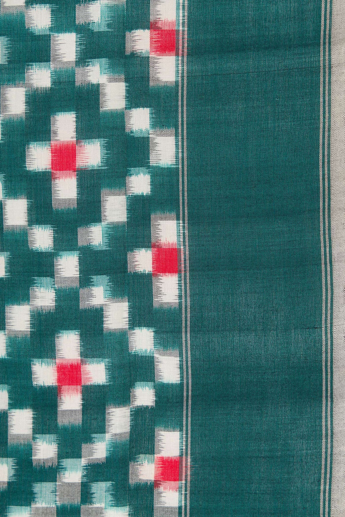 Border image of Bottle Green Dual Tone Double Ikat Saree with Ikat Print on the body and Plain Border. 