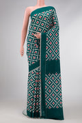 Bottle Green Dual Tone Double Ikat Saree with Ikat Print on the body and Plain Border.  displayed on a mannequin