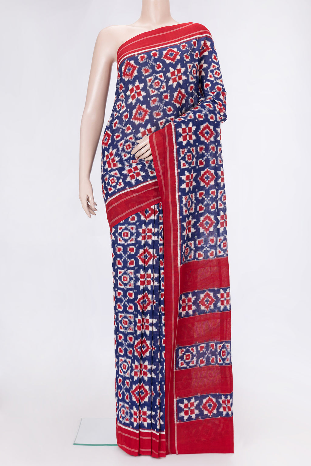 Navy Blue Dual Tone Double Ikat Saree with Ikat Print on the body and Thread Border.  displayed on a mannequin