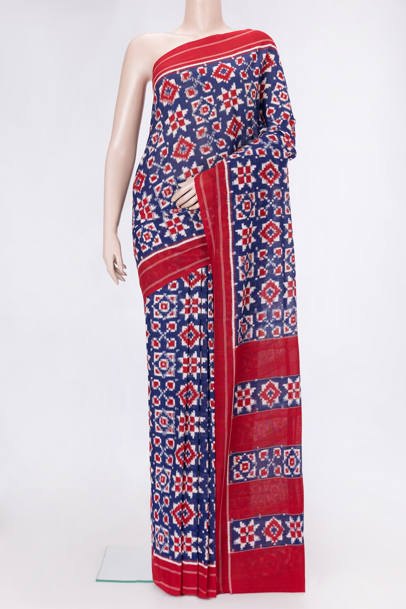 Navy Blue Dual Tone Double Ikat Saree with Ikat Print on the body and Thread Border.  displayed on a mannequin