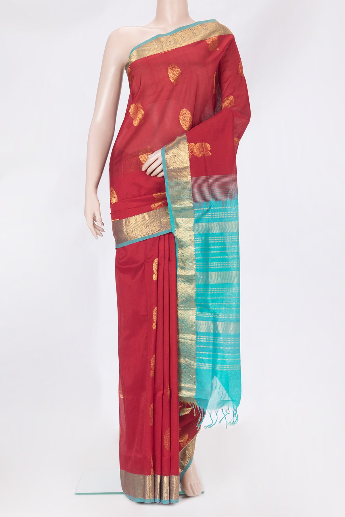Red Silk Cotton Saree with Zari Butta on the body and Zari Border.  displayed on a mannequin