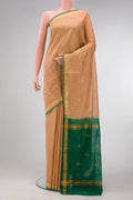 Sandal Dual Tone Uppada Cotton Saree with Zari Butta on the body and Zari Border.  displayed on a mannequin