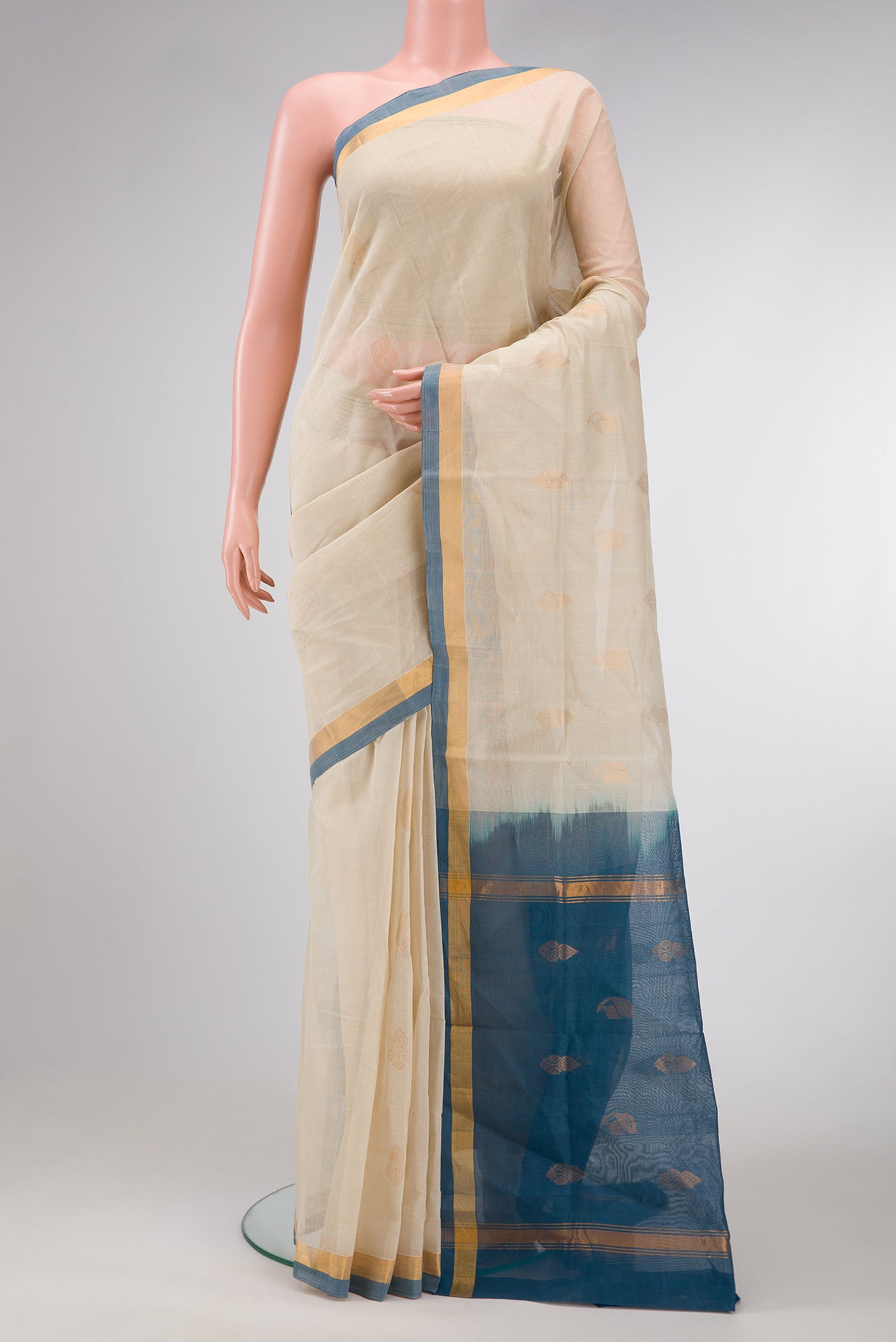 Beige Dual Tone Uppada Cotton Saree with Zari Butta on the body and Zari Border.  displayed on a mannequin