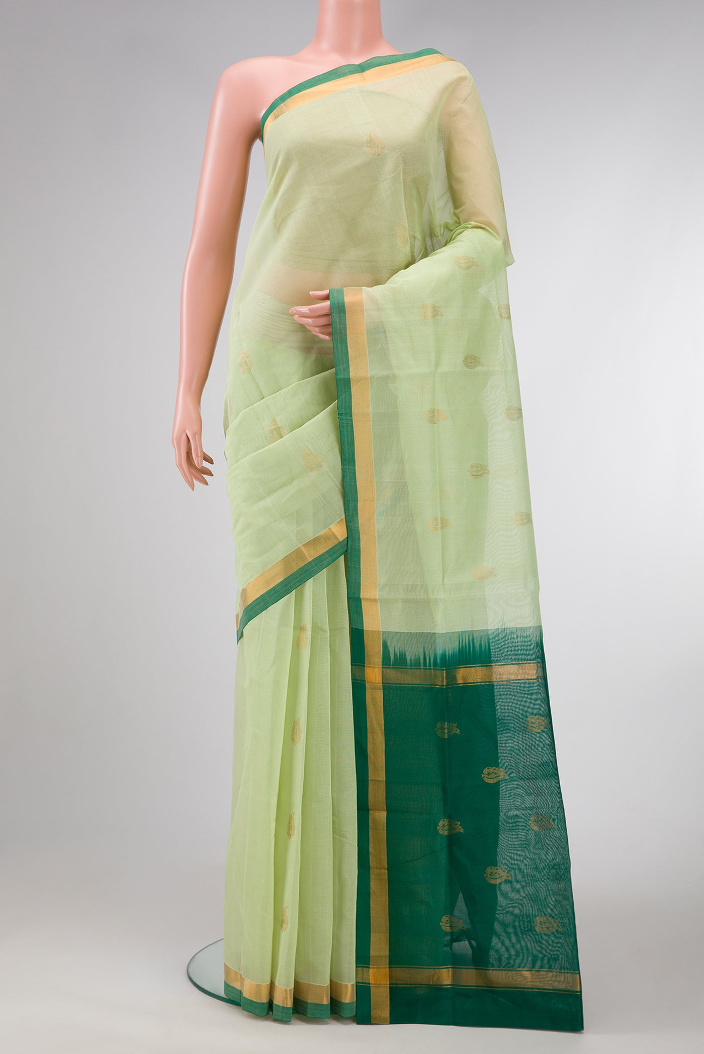 Pista Green Dual Tone Uppada Cotton Saree with Zari Butta on the body and Zari Border.  displayed on a mannequin