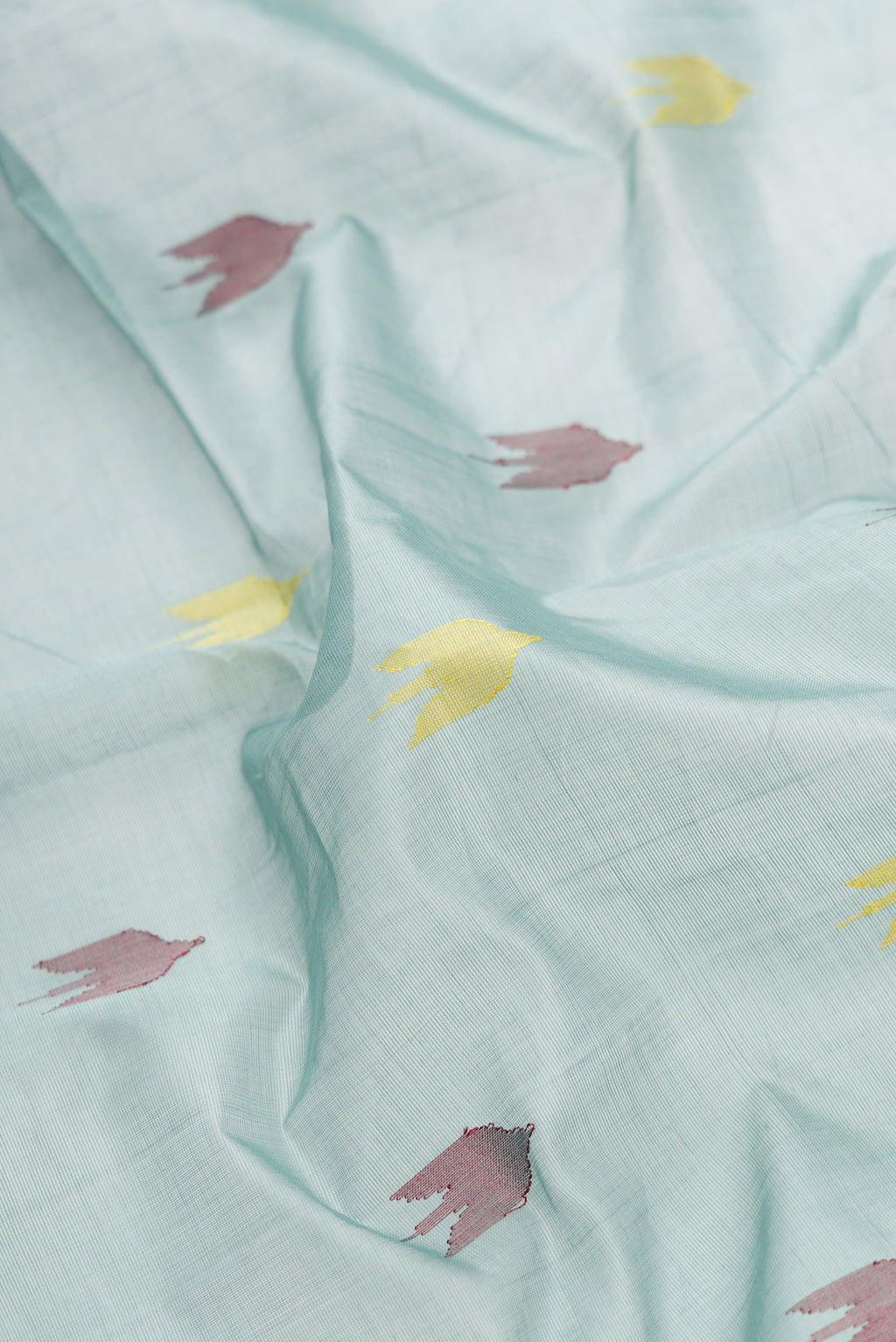 Close up of Grey Dual Tone Uppada Cotton Saree with Thread Butta on the body and Zari Border.  displaying folds
