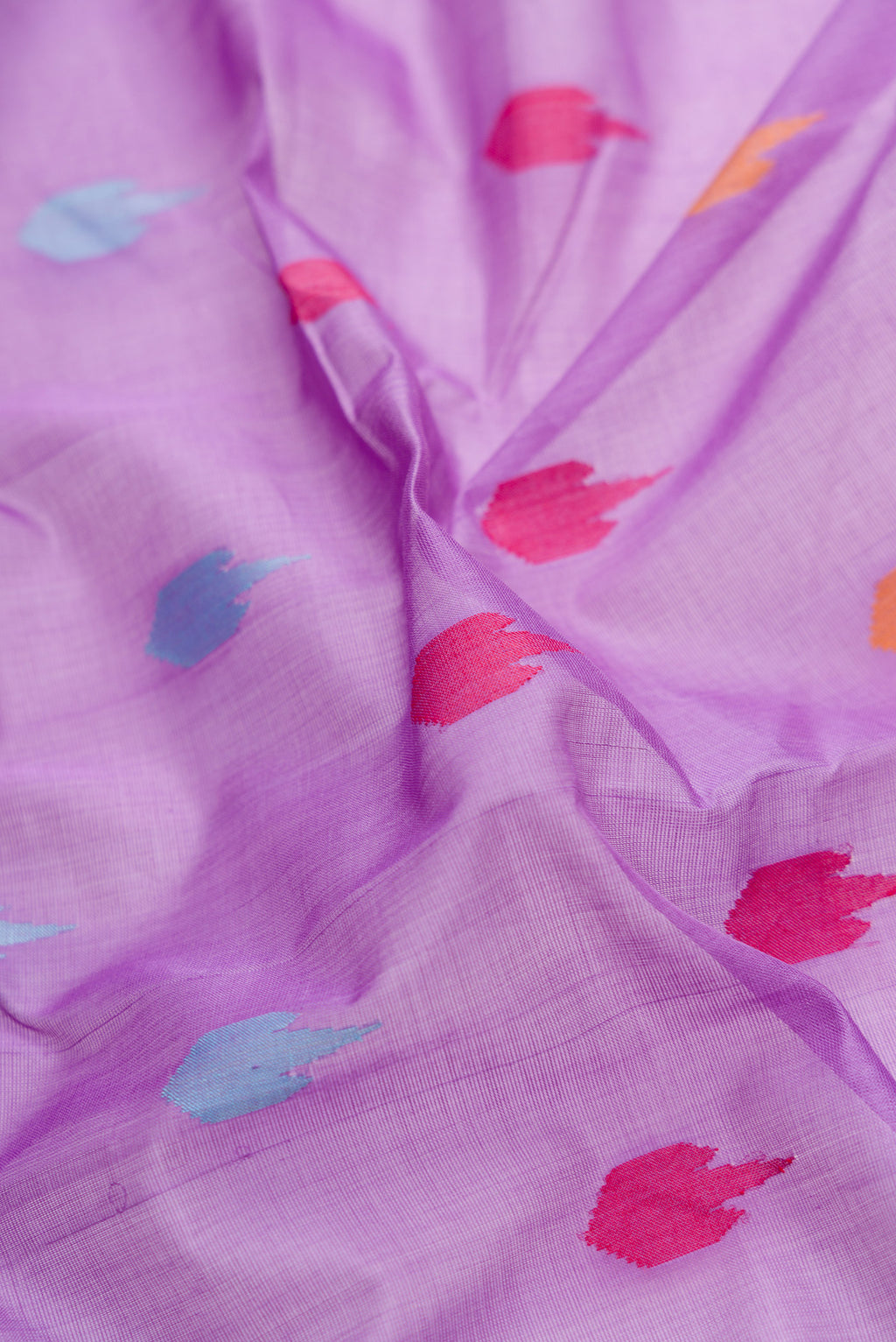 Close up of Lavender Dual Tone Uppada Cotton Saree with Thread Butta on the body and Zari Border.  displaying folds