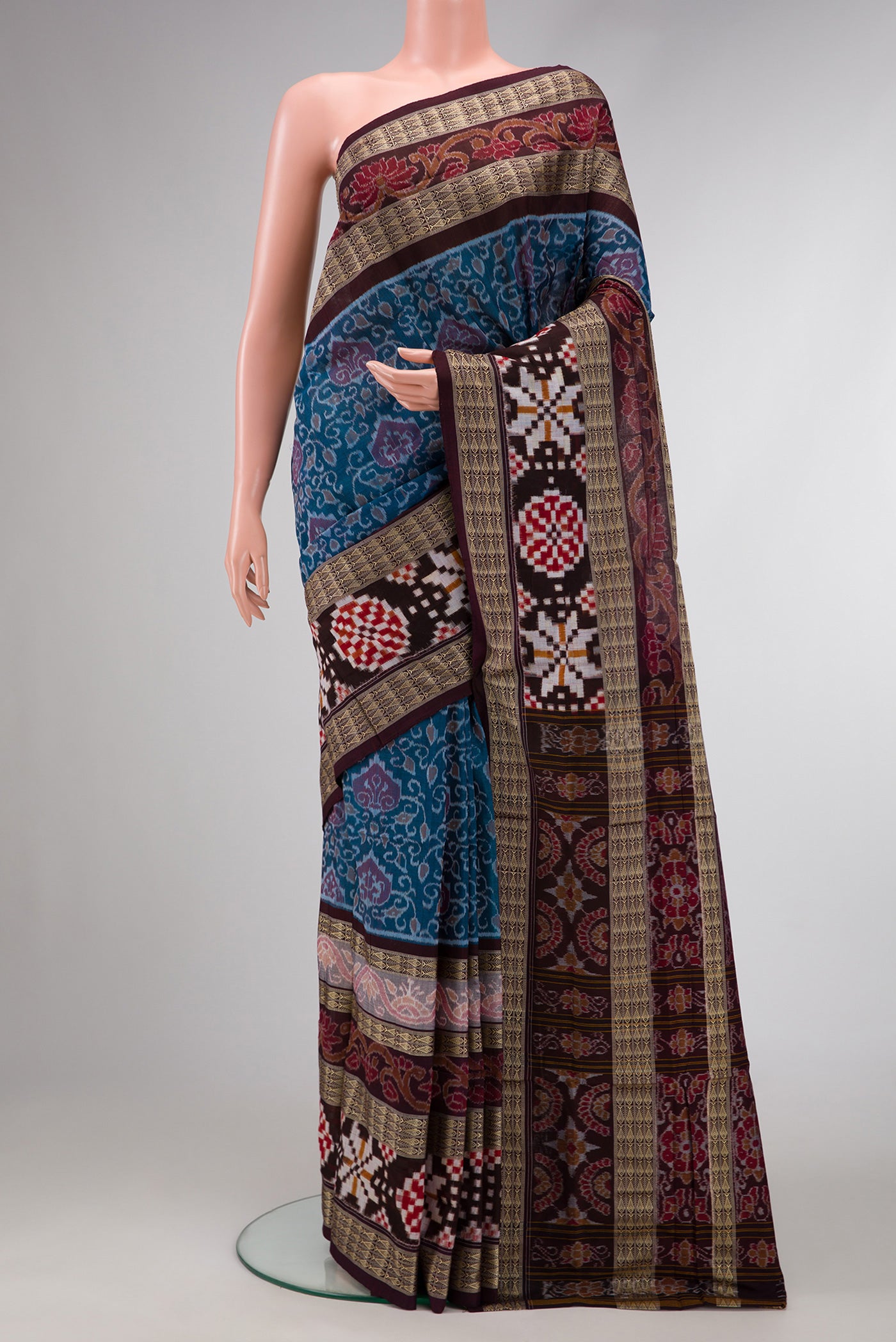Blue Dual Tone Double Ikat Saree with Ikat Print on the body and Thread Border.  displayed on a mannequin