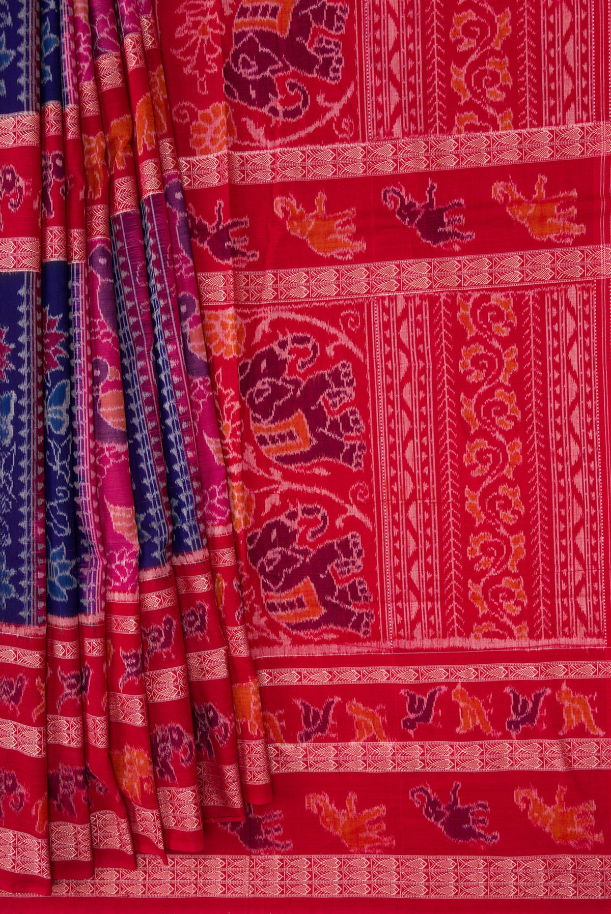 Pleats and pallu of Royal Blue Dual Tone Double Ikat Saree with Ikat Print on the body and Thread Border. 