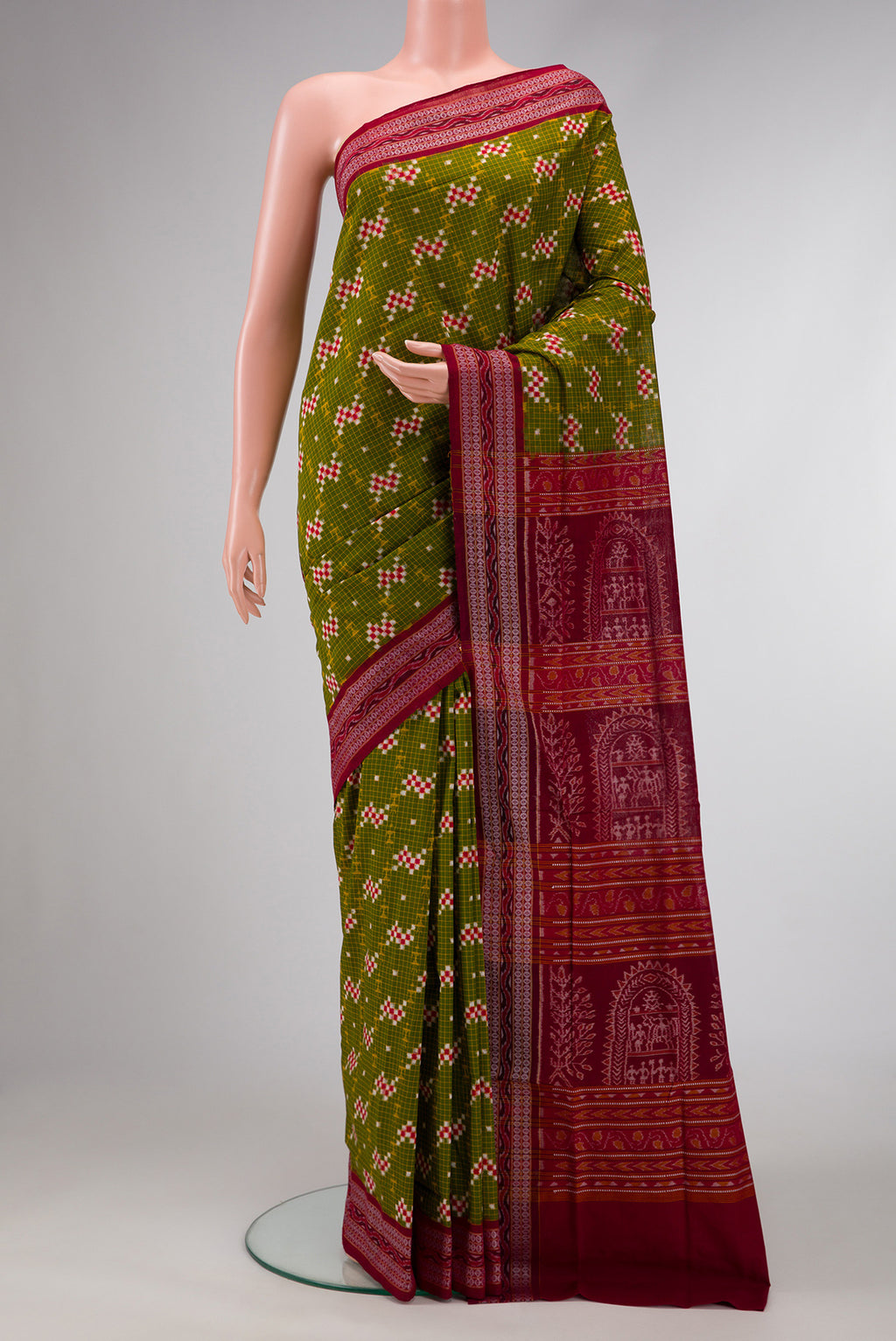Green Dual Tone Double Ikat Saree with Ikat Print on the body and Thread Border.  displayed on a mannequin