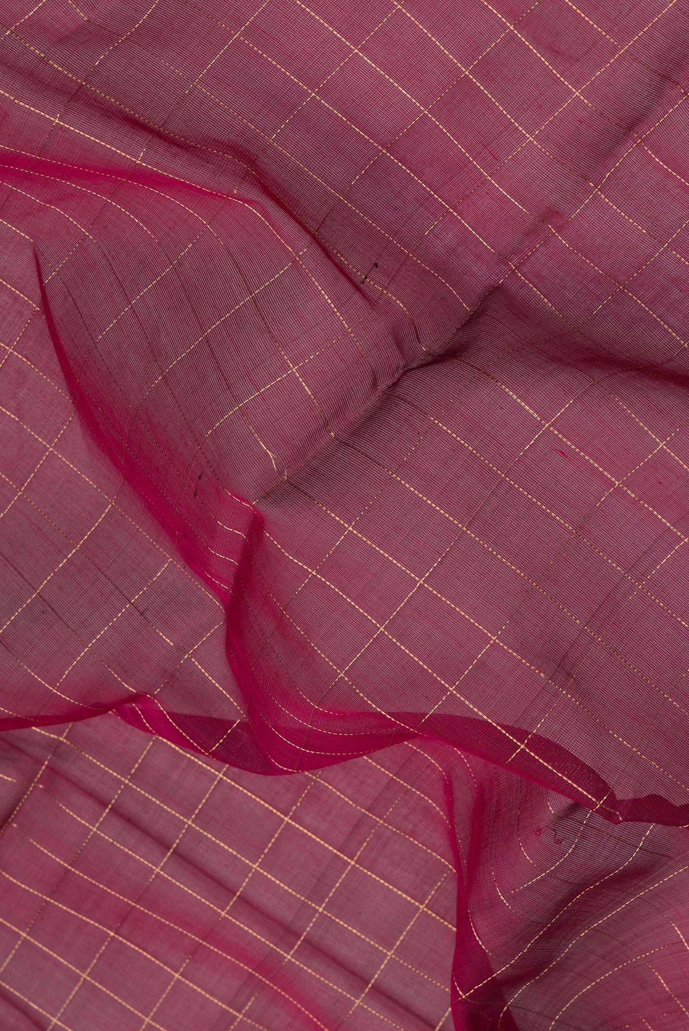 Close up of Maroon Silk Cotton Saree with Checked design on the body and Fancy Border.  displaying folds