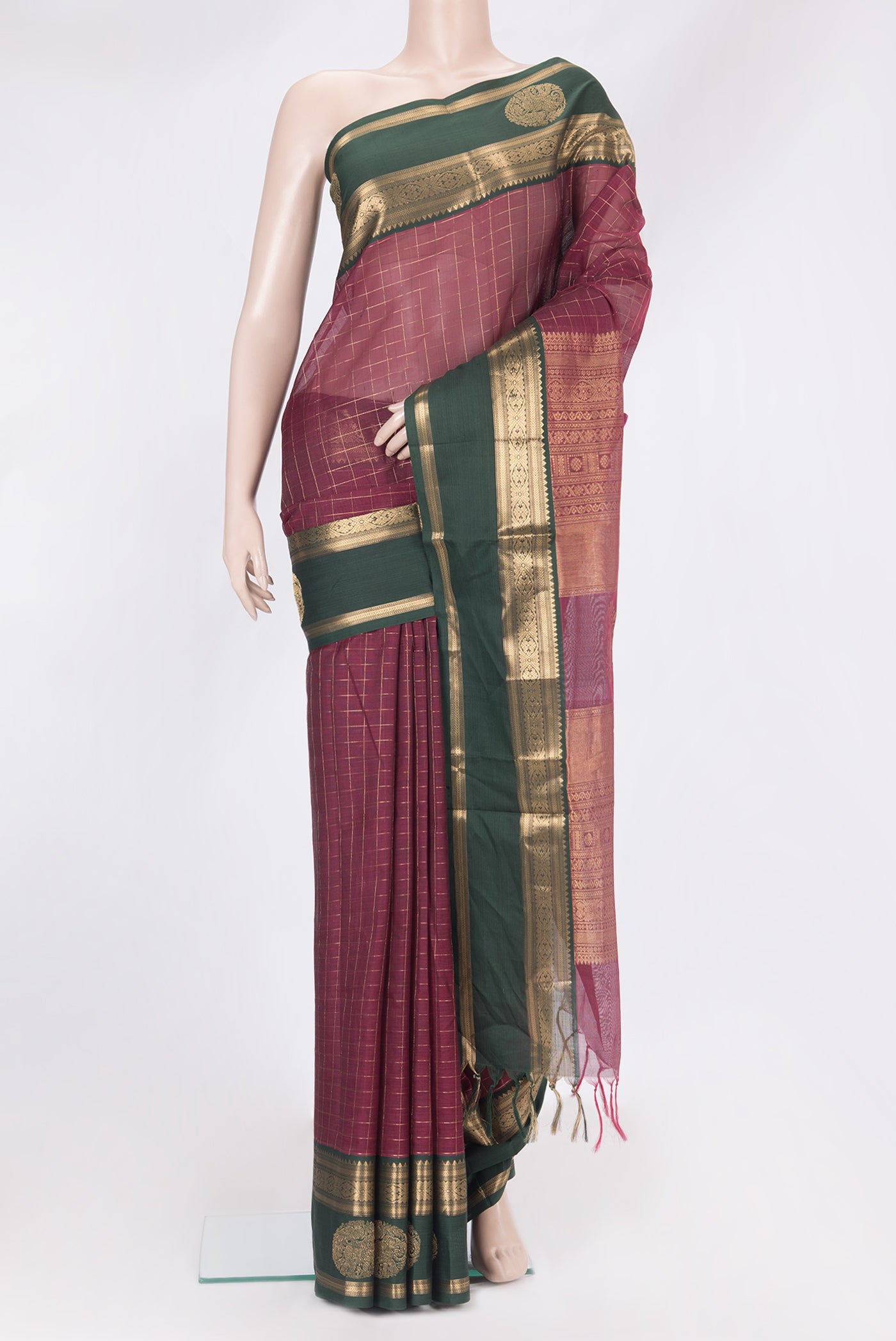 Maroon Silk Cotton Saree with Checked design on the body and Fancy Border.  displayed on a mannequin