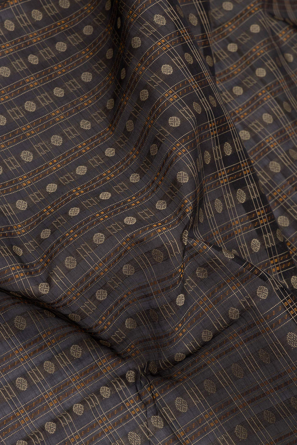 Close up of Black Silk Cotton Saree with Checked design on the body and Zari Border.  displaying folds