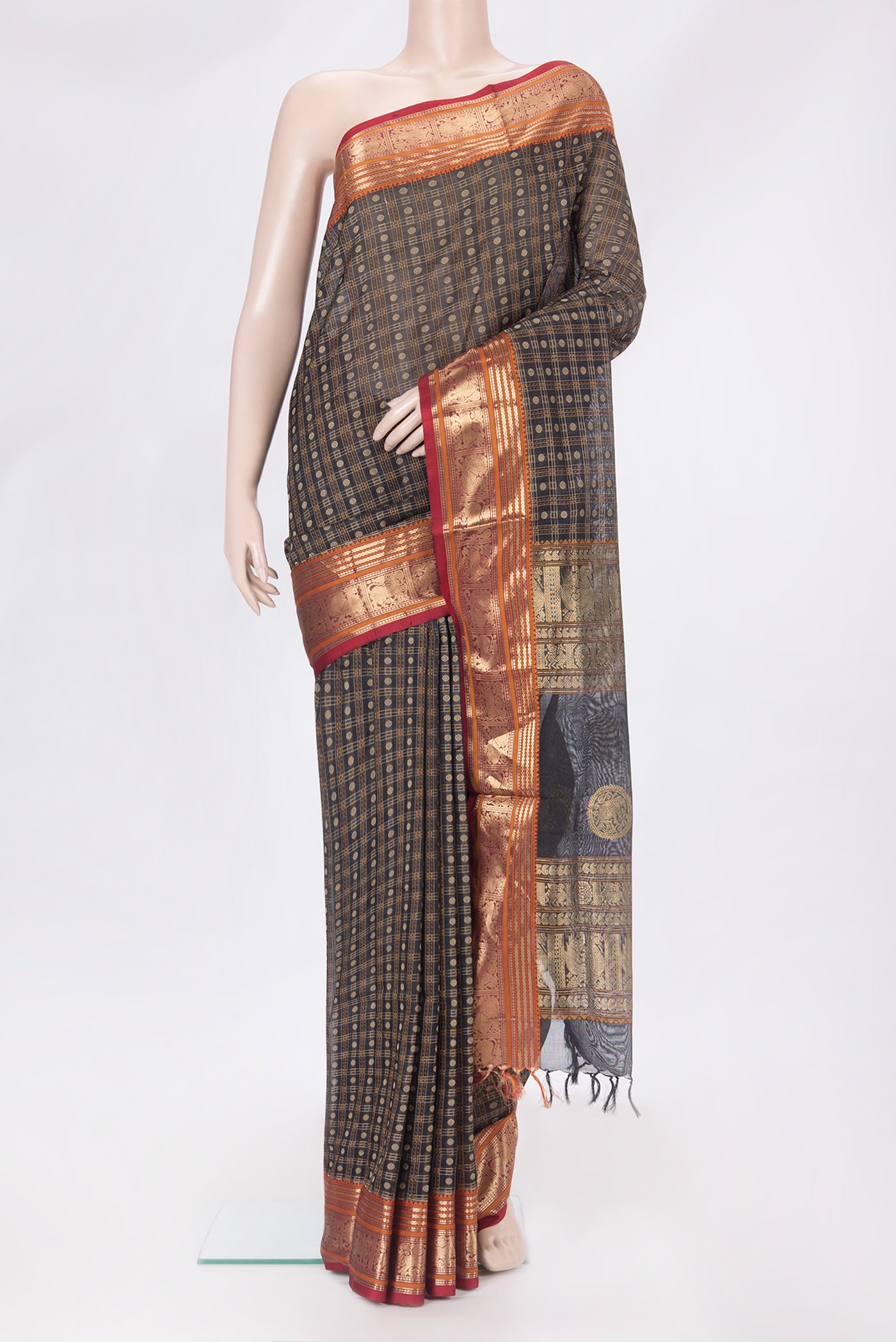 Black Silk Cotton Saree with Checked design on the body and Zari Border.  displayed on a mannequin